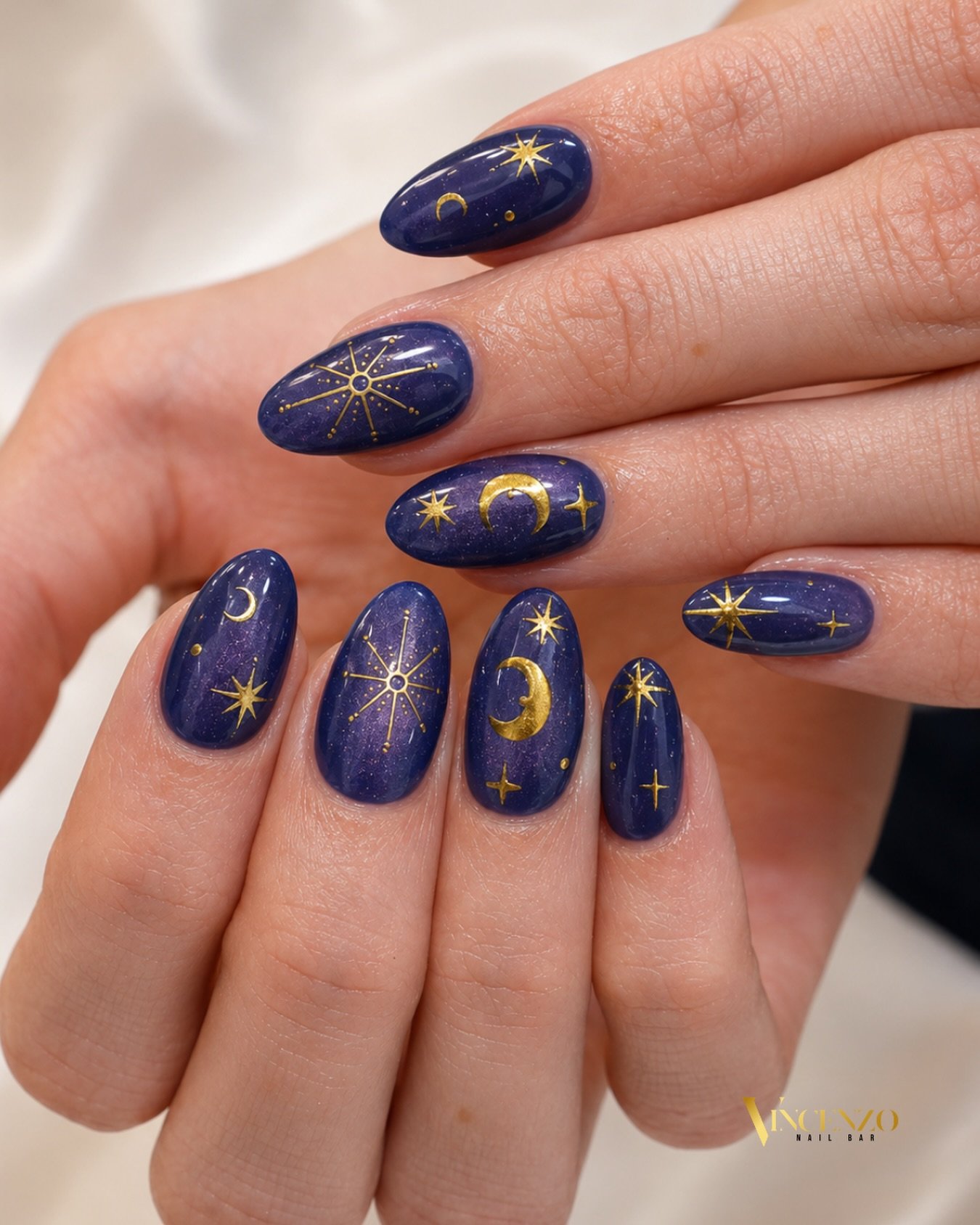 Deep Blue Oval Nails with Gold Starry Accents — Dalpq4xBvtGVincenzo Nail Bar.jpg