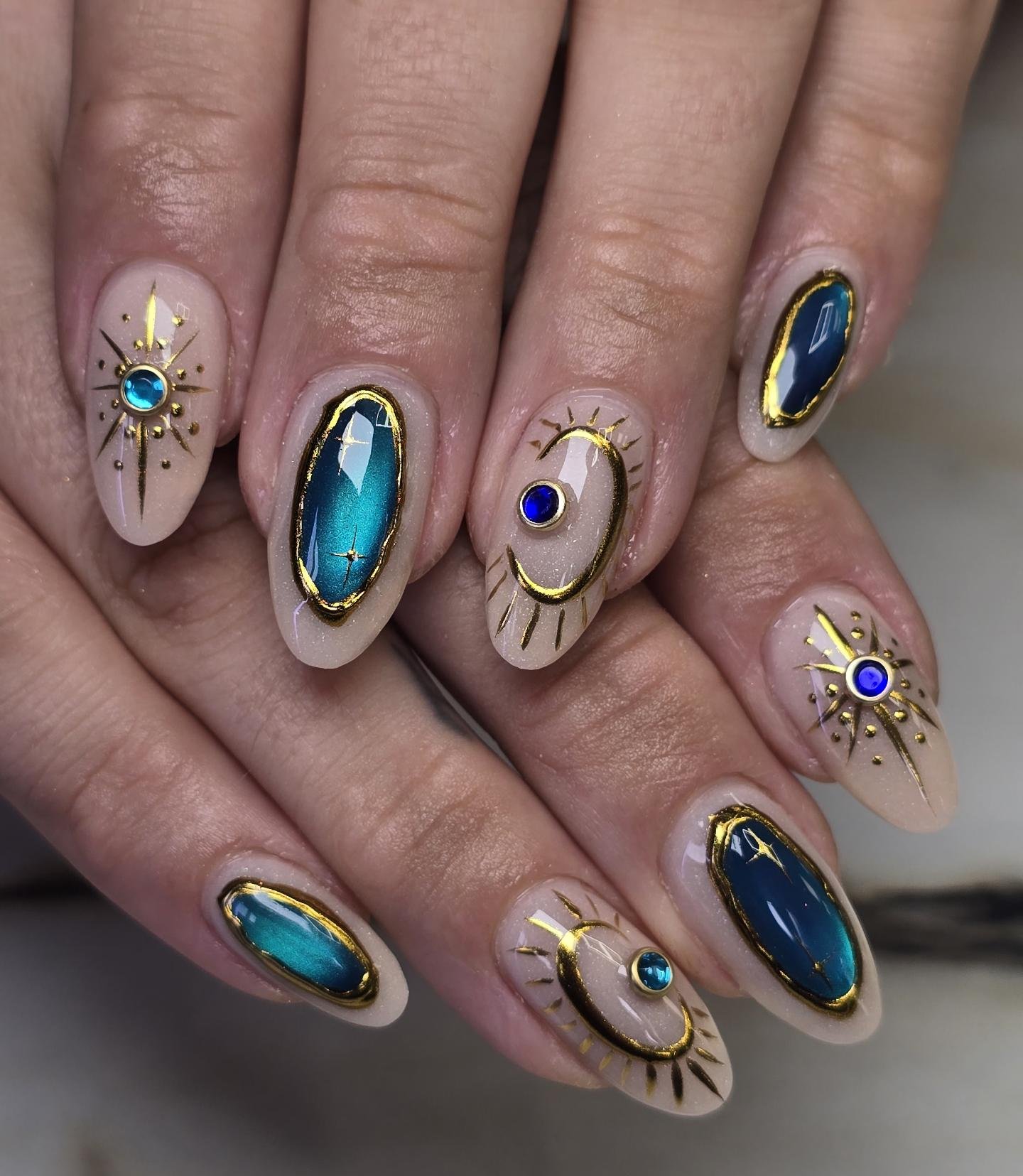 Blue Chrome Almond Nails with Gold and Turquoise Accents — DbLrXZHuHyENikki.jpg