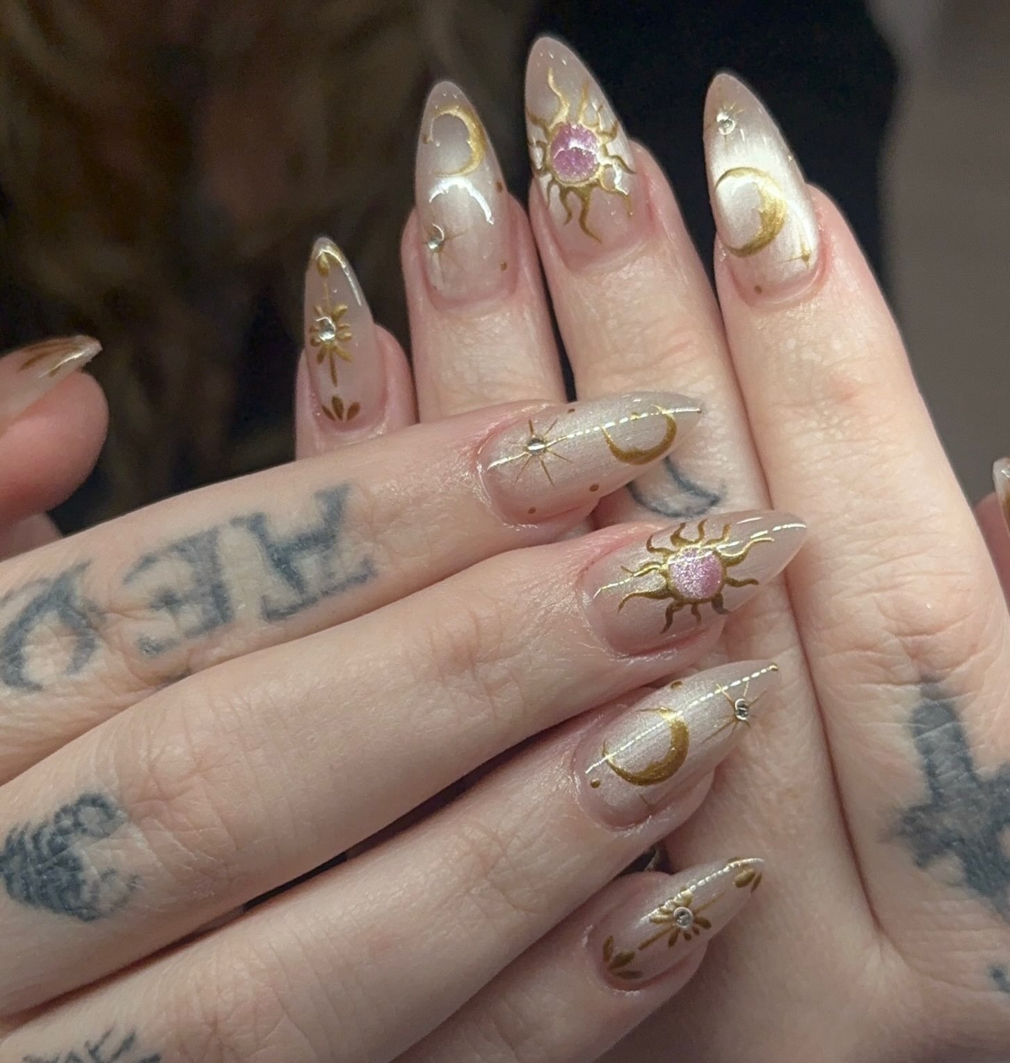 Milky Stiletto Nails with Gold and Pink Celestial Accents — DdG96xXuHTsBeyond Nails & Spa.jpg
