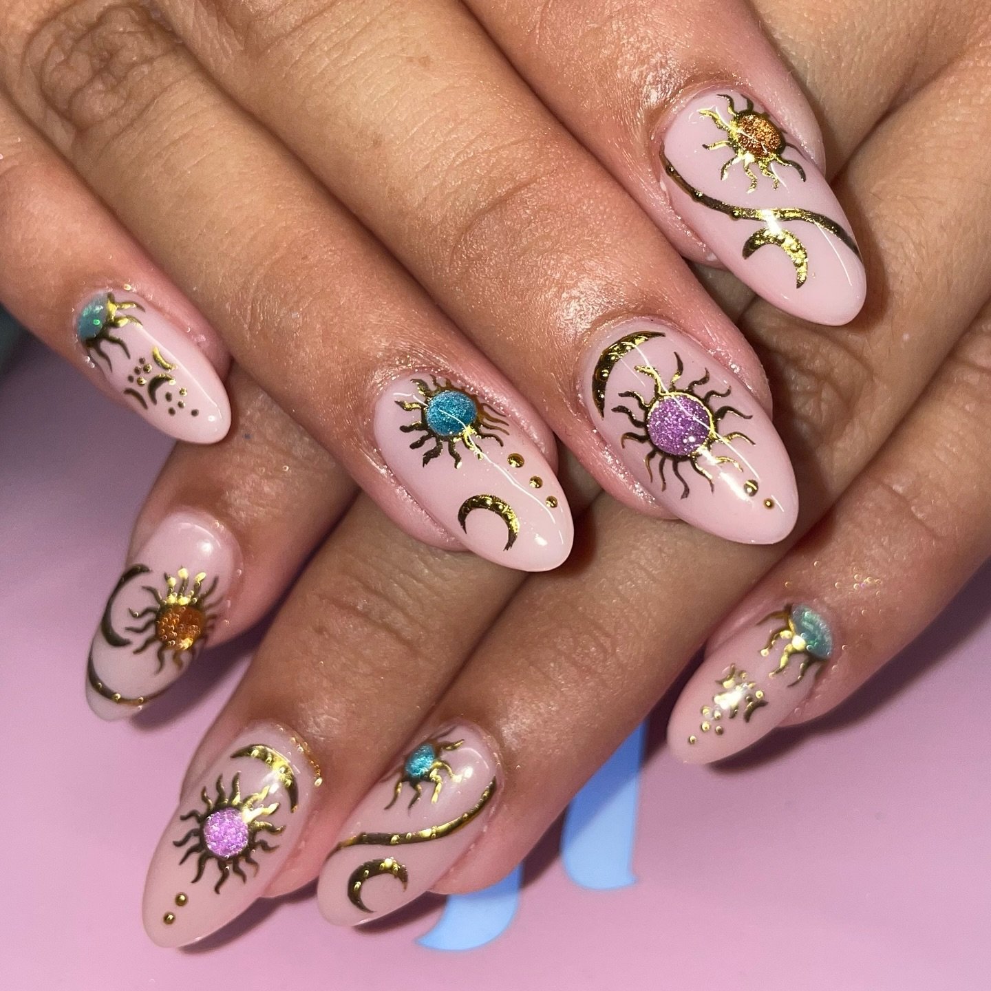 Pink Almond Nails with Purple and Gold Sunburst Details — DNTlXLpJ7j8Chelsea Doing Nails.jpg
