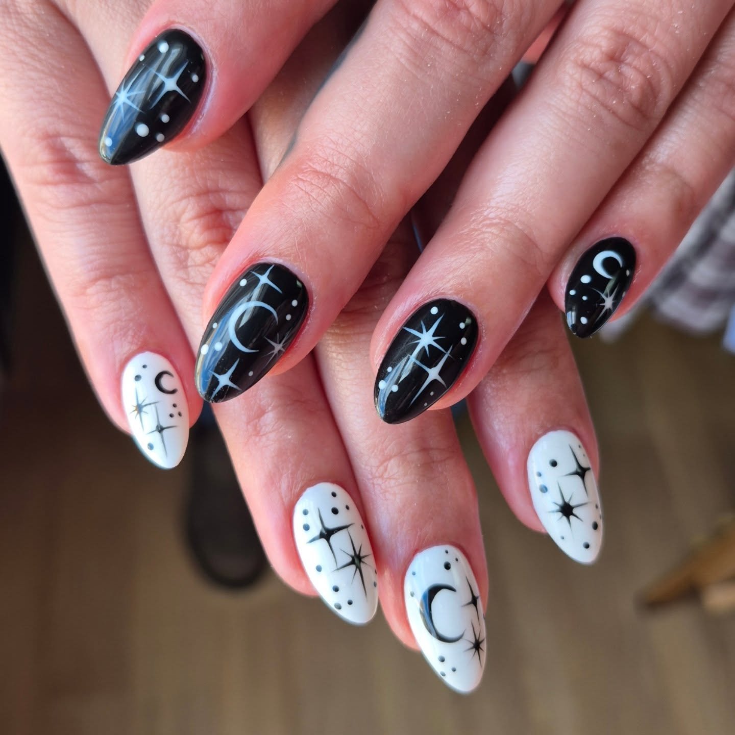 Black and White Almond Nails with Stars and Curved Motifs — DQFxstlDKJDSpellbound Nail Artistry.jpg