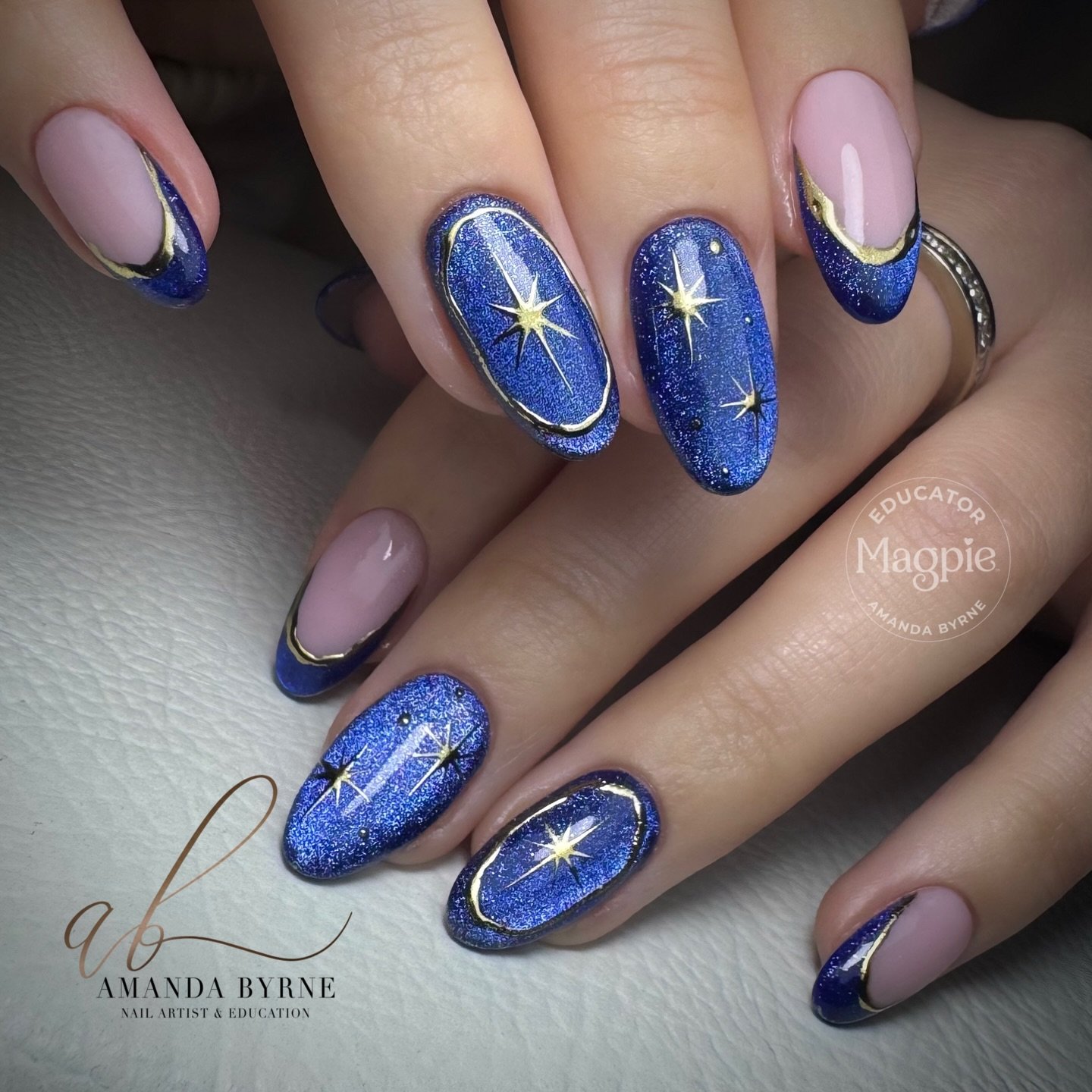 Blue and Lavender Almond Nails with Gold Starbursts — DT6K8bIDF23AMANDA BYRNE NAIL ARTIST.jpg