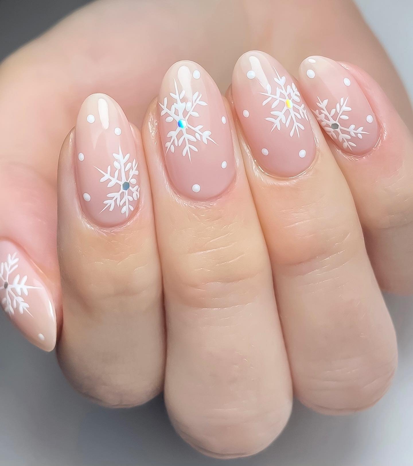 Sheer Pink Nails with White Snowflakes and Glitter