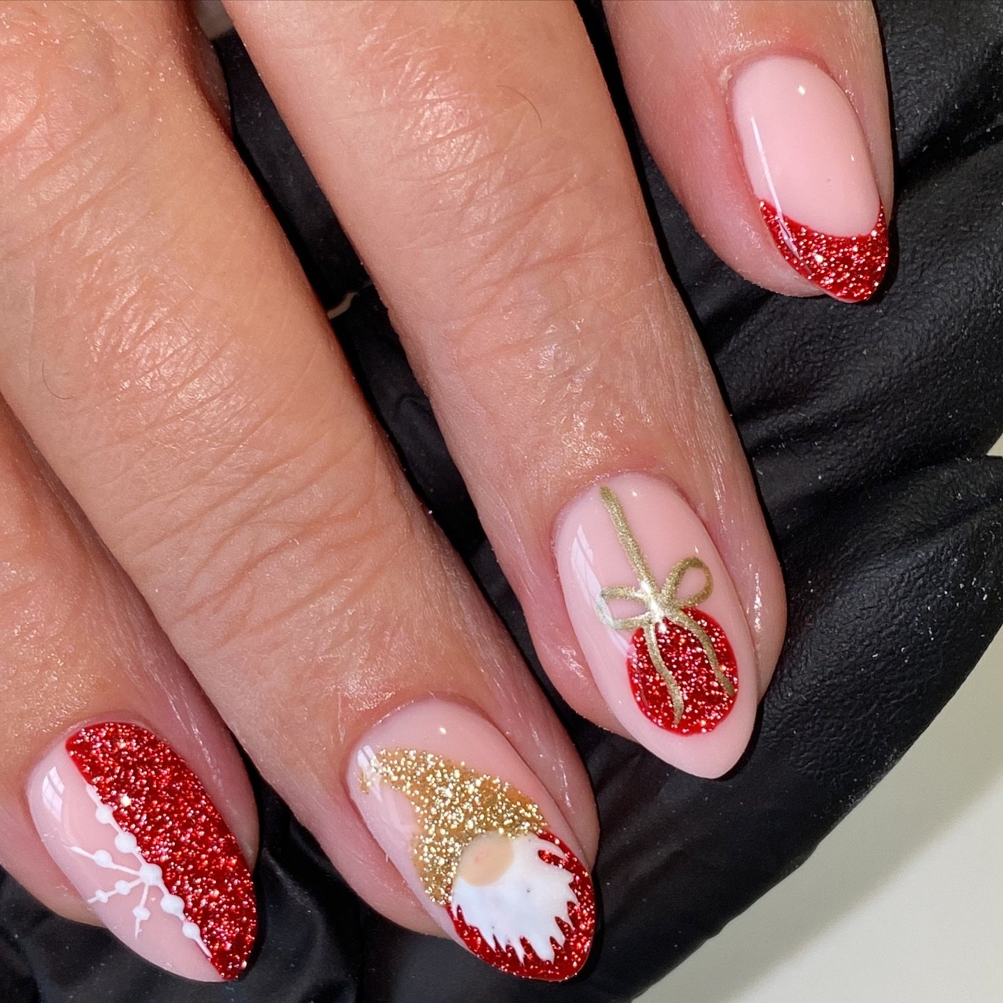 Short Nude Nails with Red Glitter Tips and Gold Holiday Accents