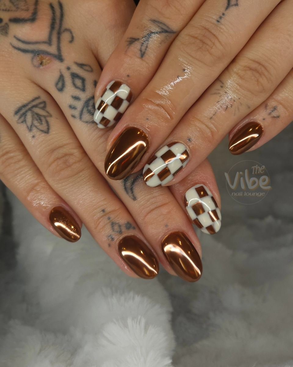 Brown Almond Nails with Checkered and Abstract Accents