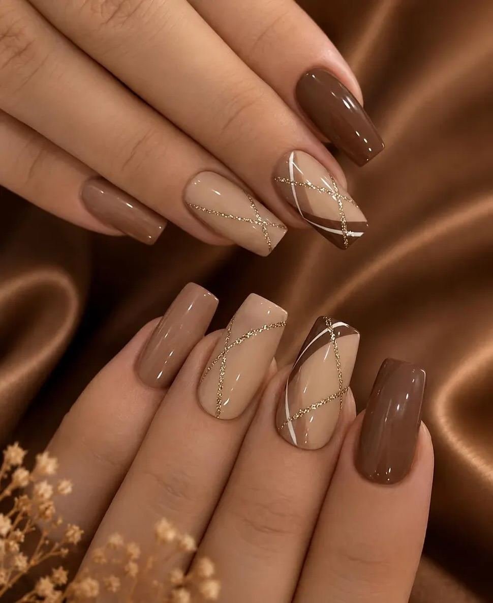 Neutral Almond Nails with Brown and Gold Accents