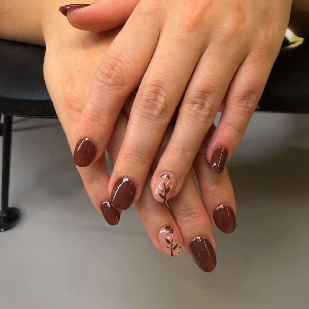 Brown Almond Nails with Delicate Accent Art