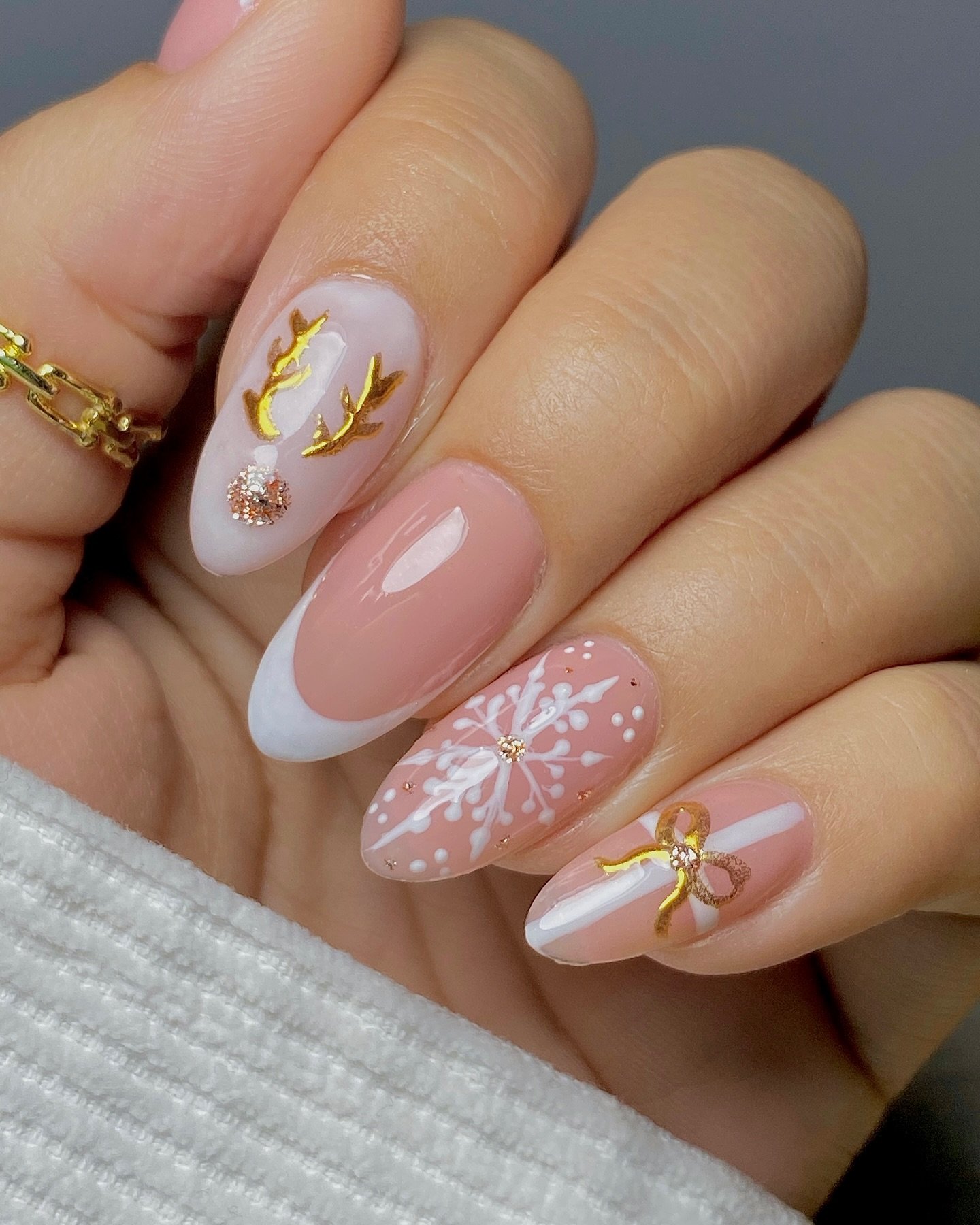 Sheer Pink Almond Nails with White Tips and Gold Holiday Details