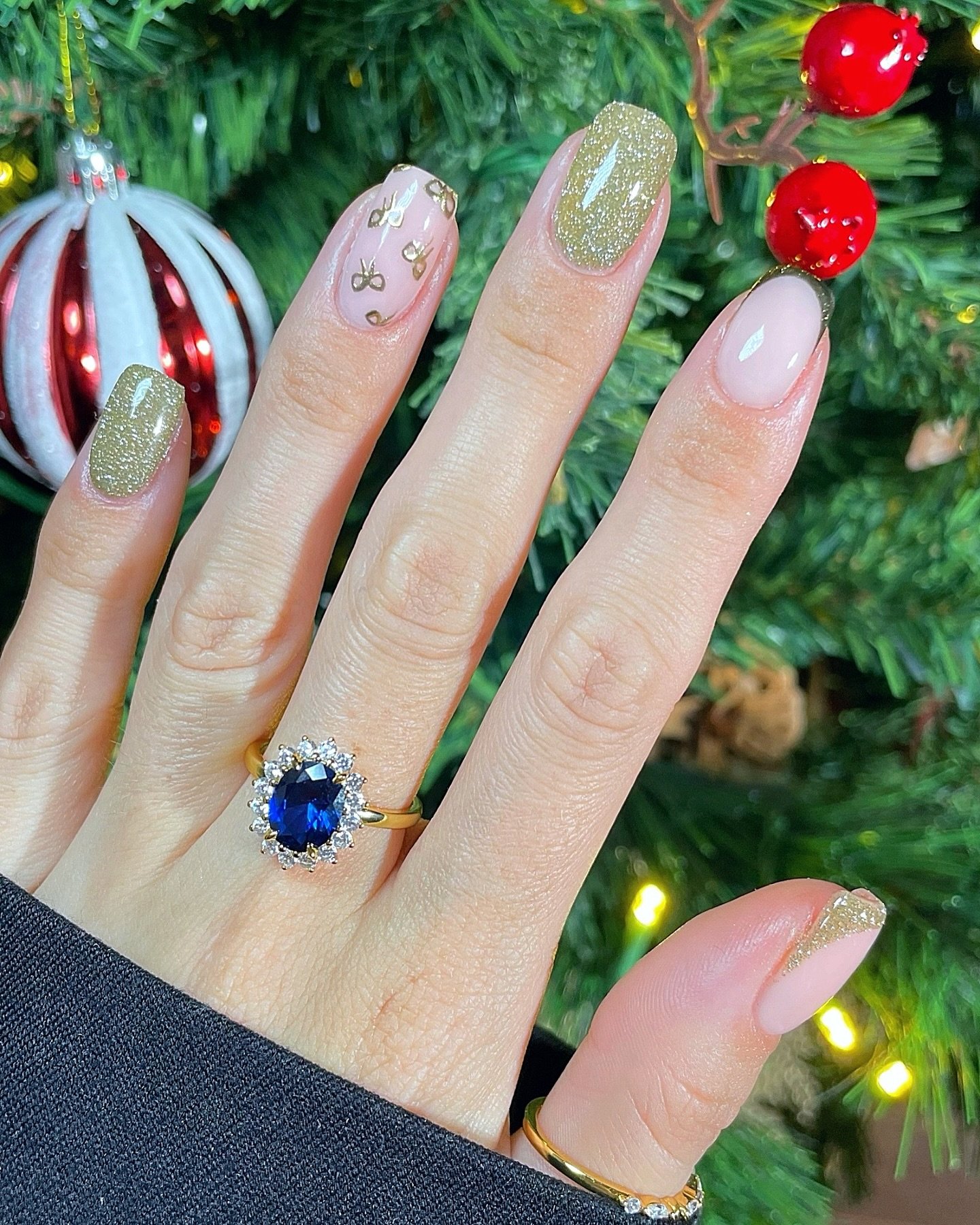 Long Almond Nails with Green Glitter and Mixed Holiday Details