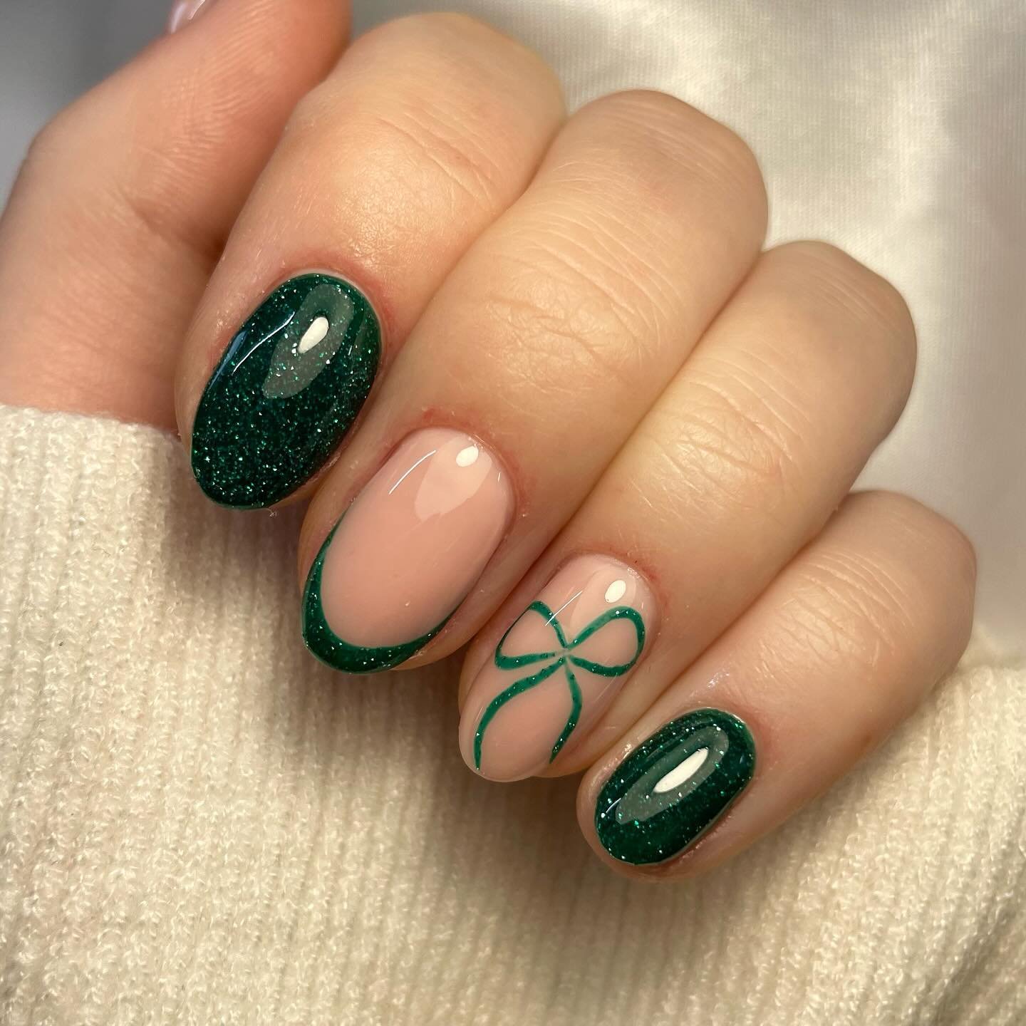 Deep Green Short Oval Nails with a Green Bow Accent