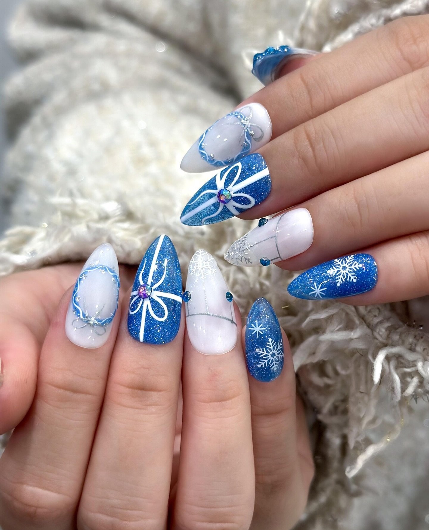 Blue and White Snowflake Nails