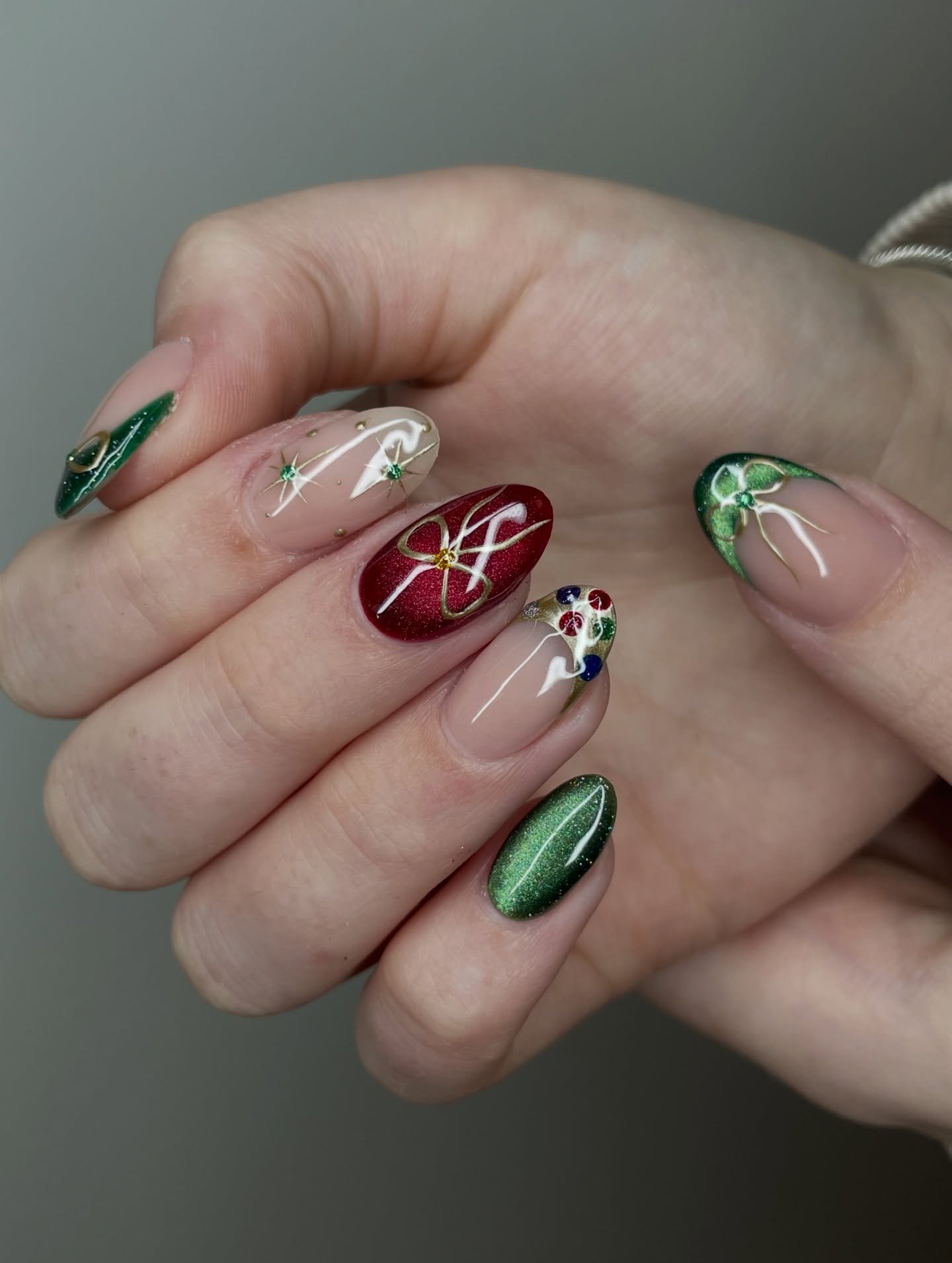 Green, Red, and Nude Nails with Gold Bow Details