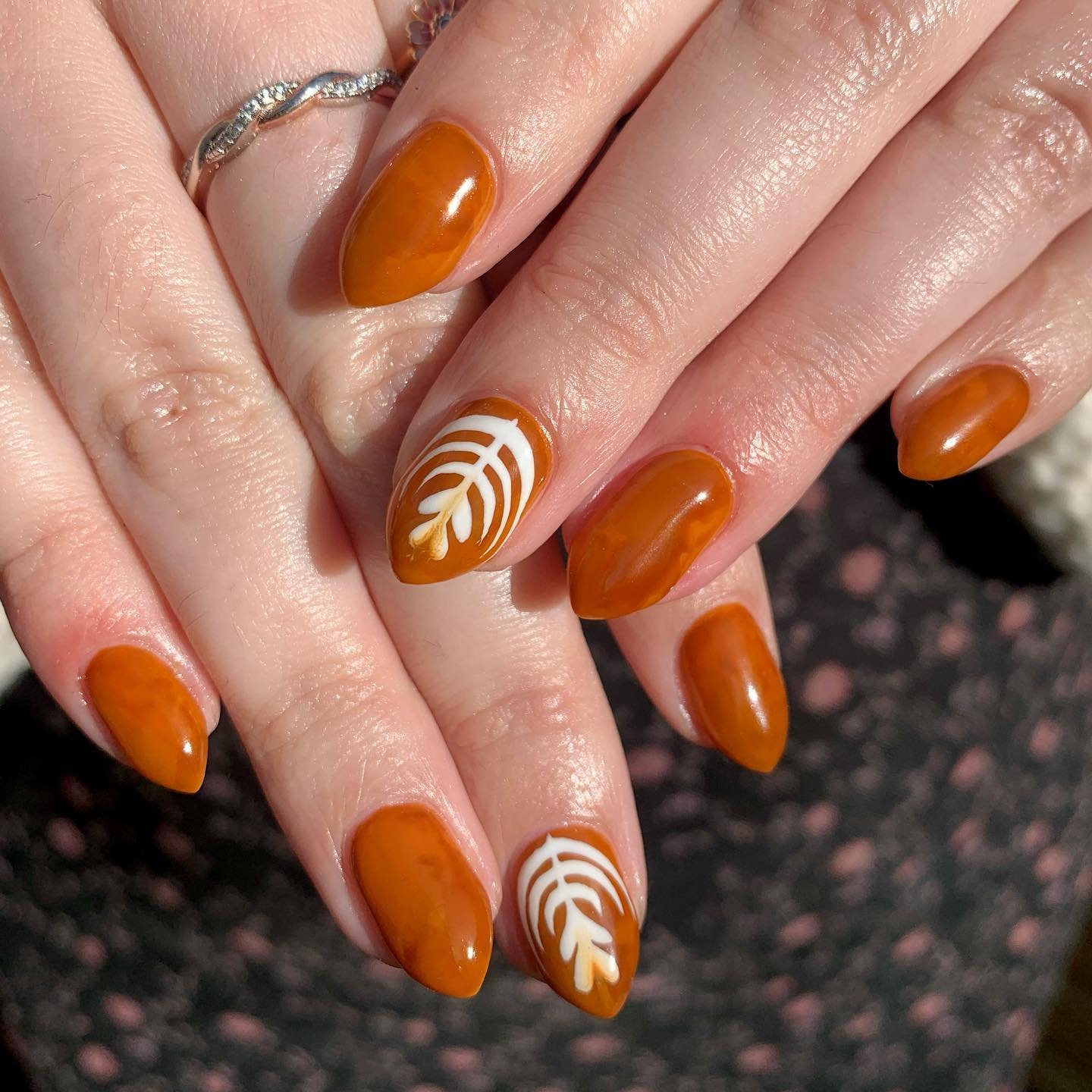 Burnt Orange Almond Nails with White Swirl Accents