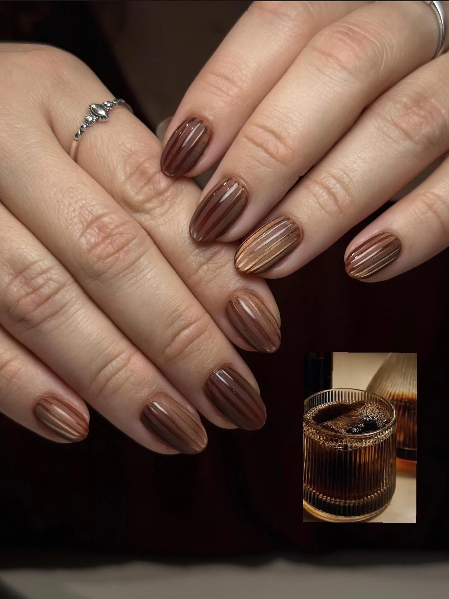 Glossy Mocha Brown Nails with Subtle Striped Accents