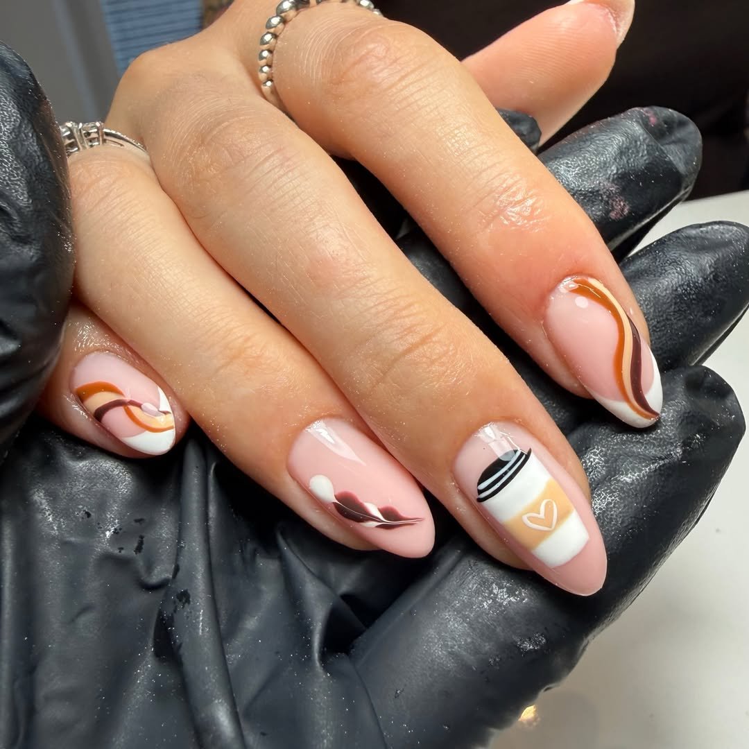 Soft Pink and Brown Almond Nails with Abstract Accents