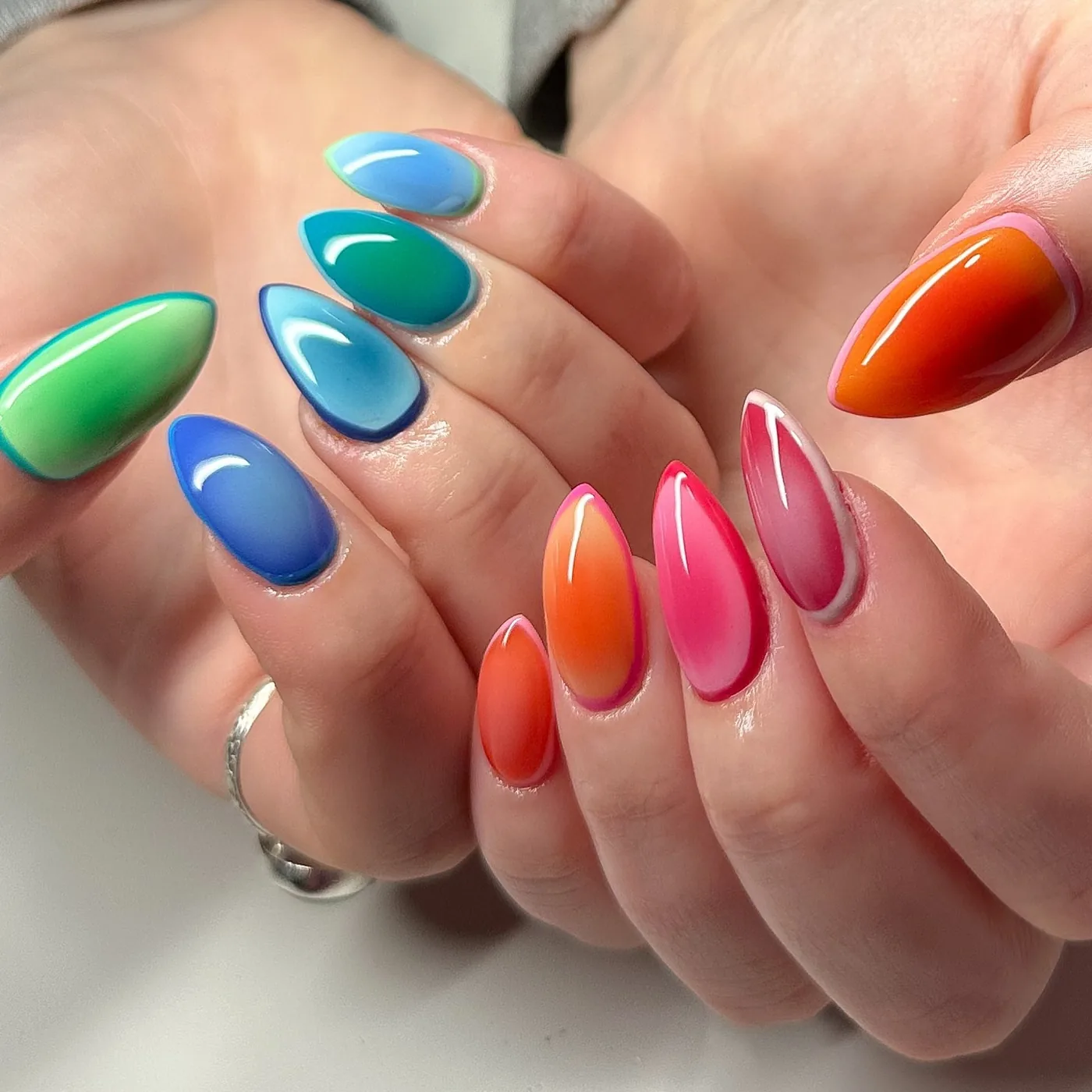 Glossy Blue, Green, and Pink Almond Nails — DE0LNA1yOWISuelen Bagley Nail Tech.jpg