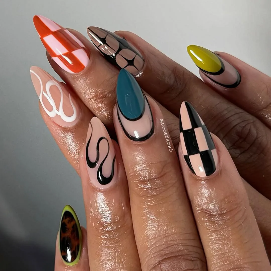 Long Graphic Nails in Orange, Brown, Black, and Nude — DGjb5VuxPGothe tease.jpg