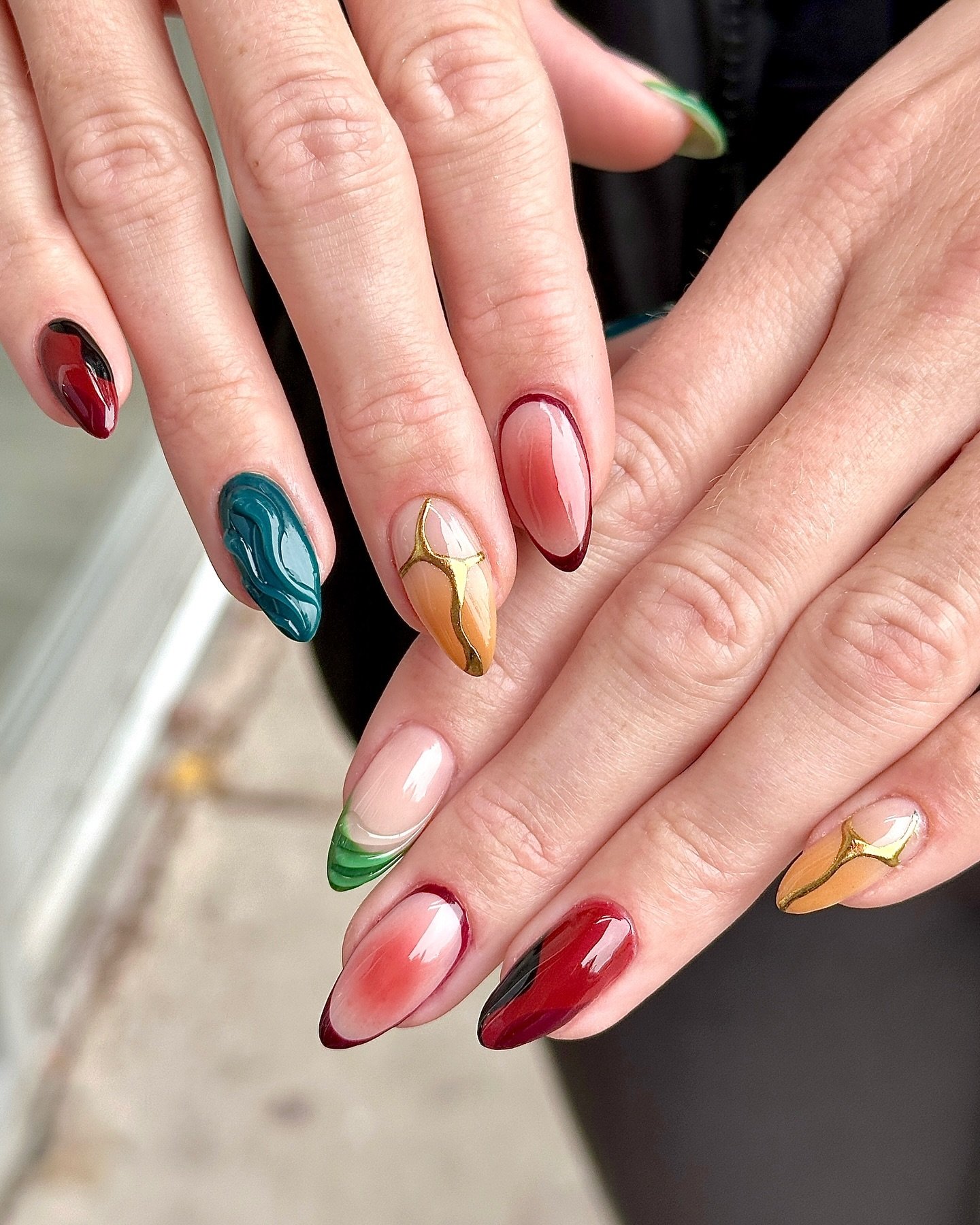 Colorful Almond Nails with Small Botanical Accents