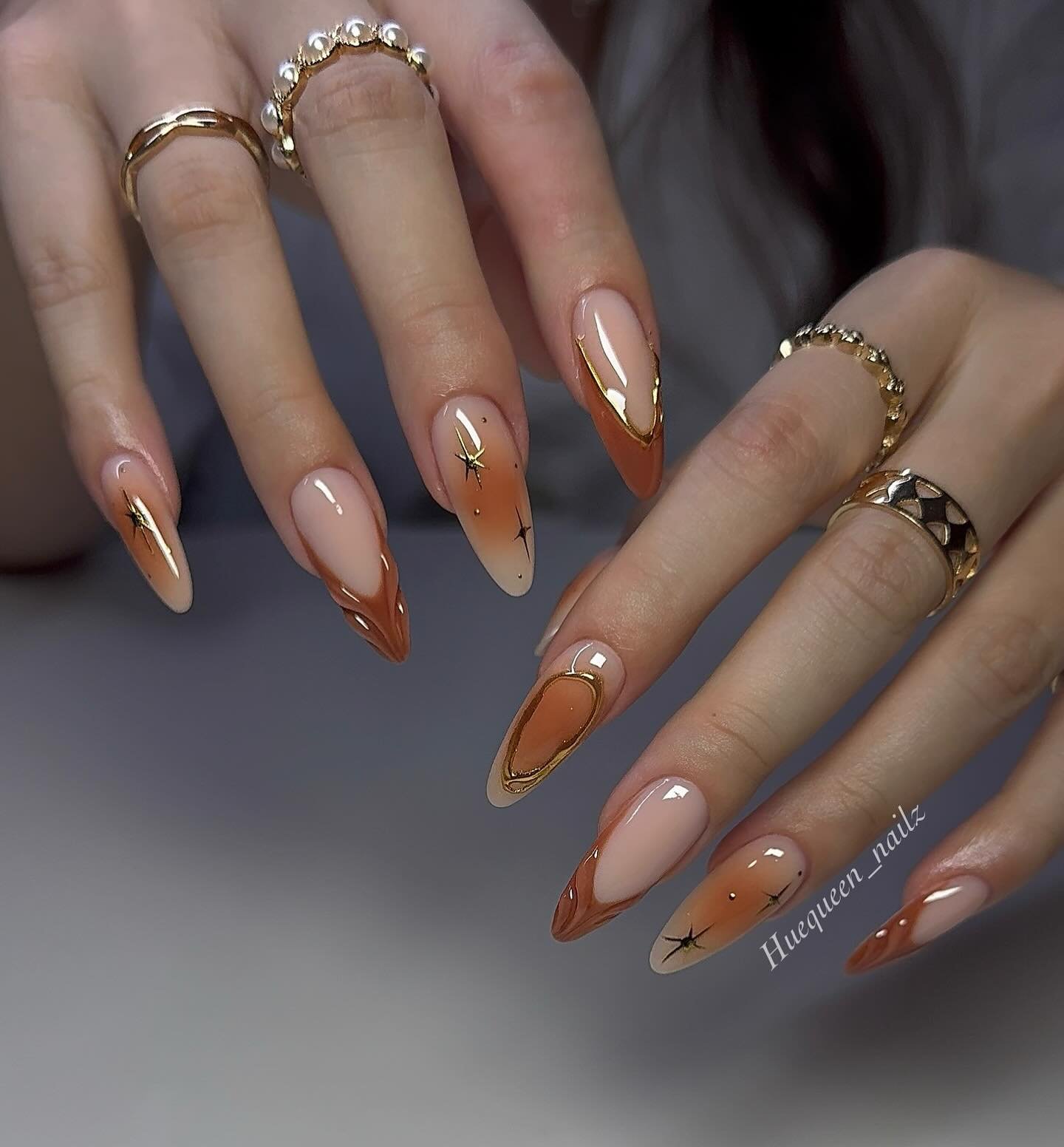 Nude Almond Nails with Copper French Tips and Fine Accents
