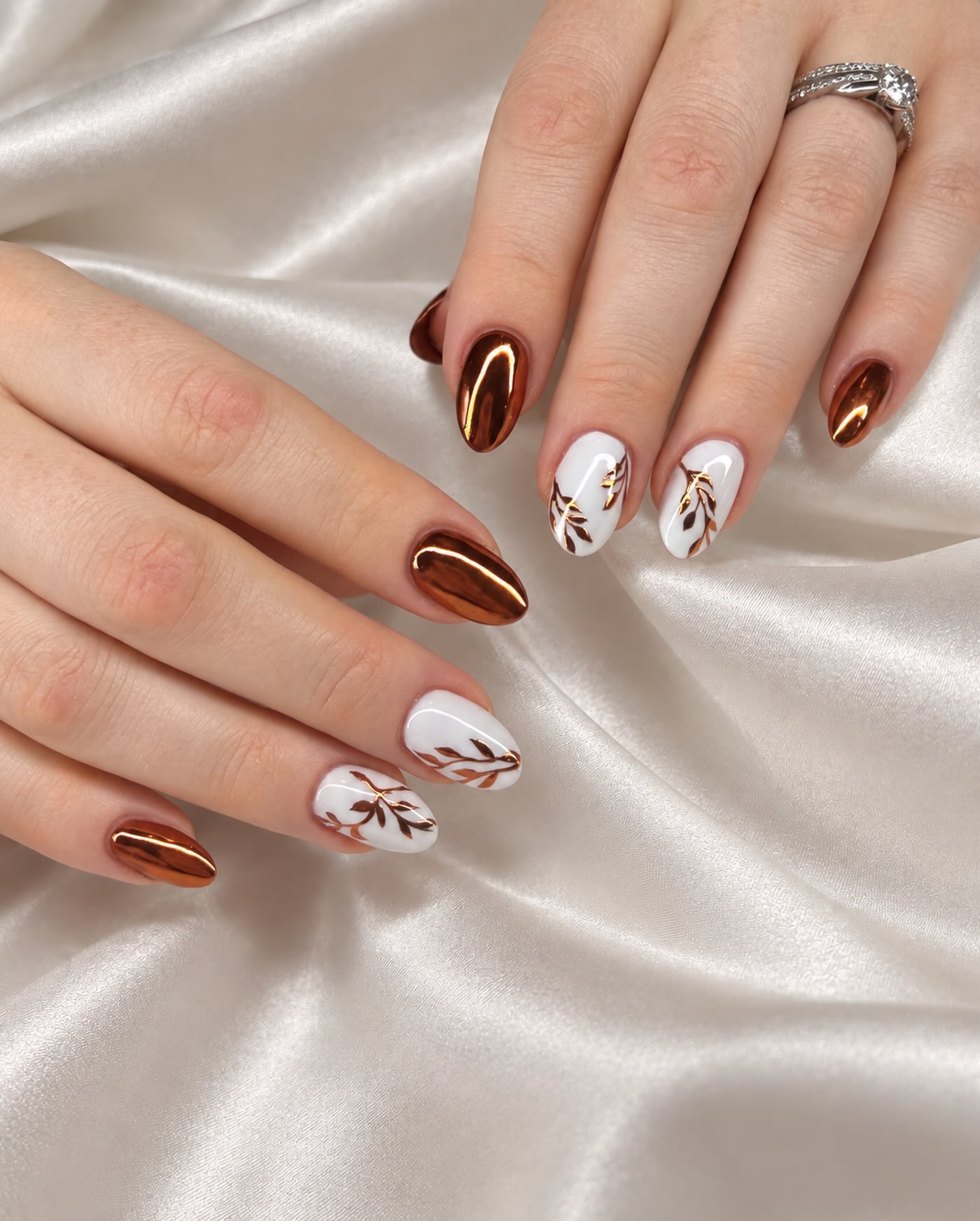 White and Brown Oval Nails with Copper-Toned Accents