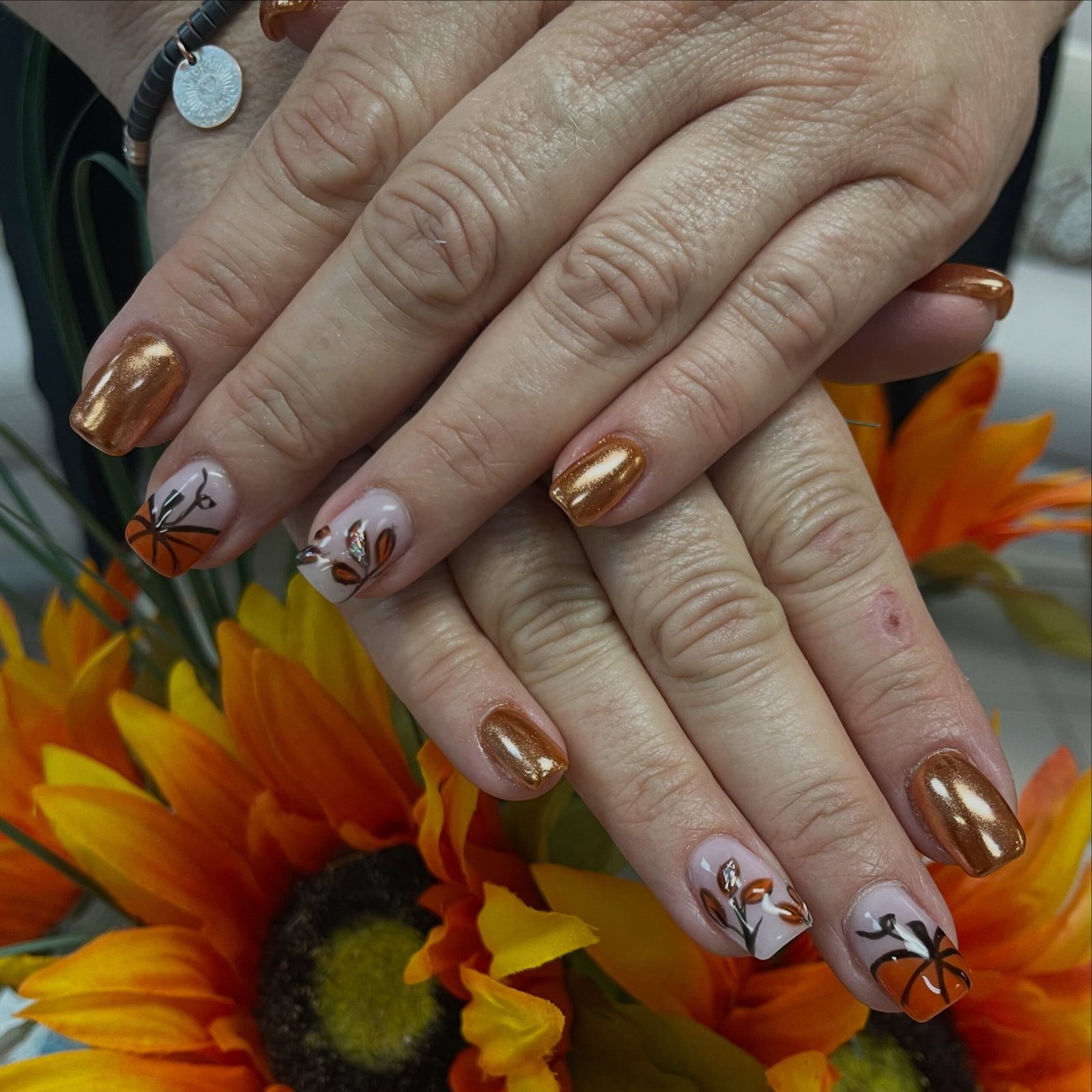 Copper and White Almond Nails with Leaf Motifs