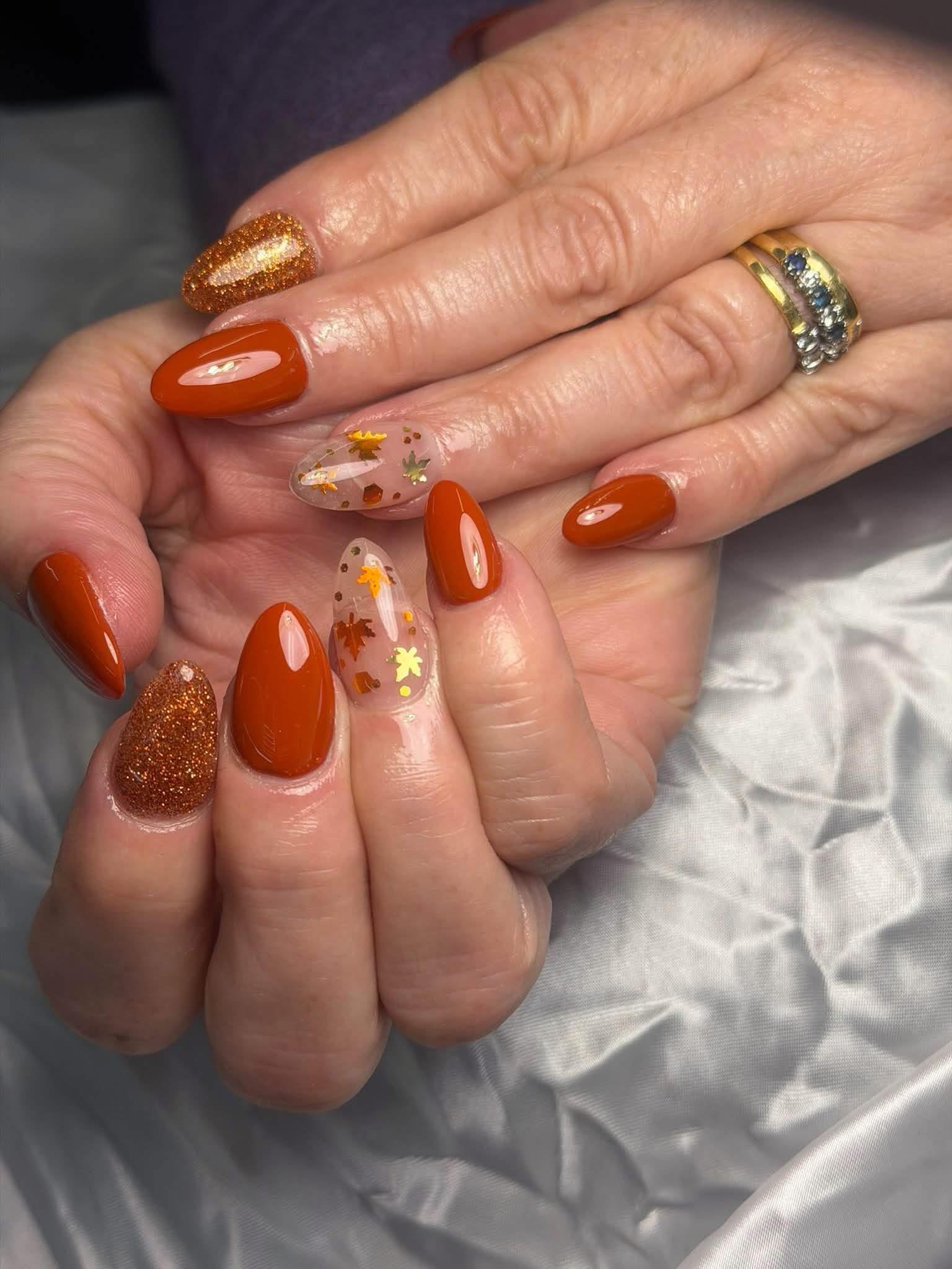Orange Almond Nails with Copper Glitter Accents