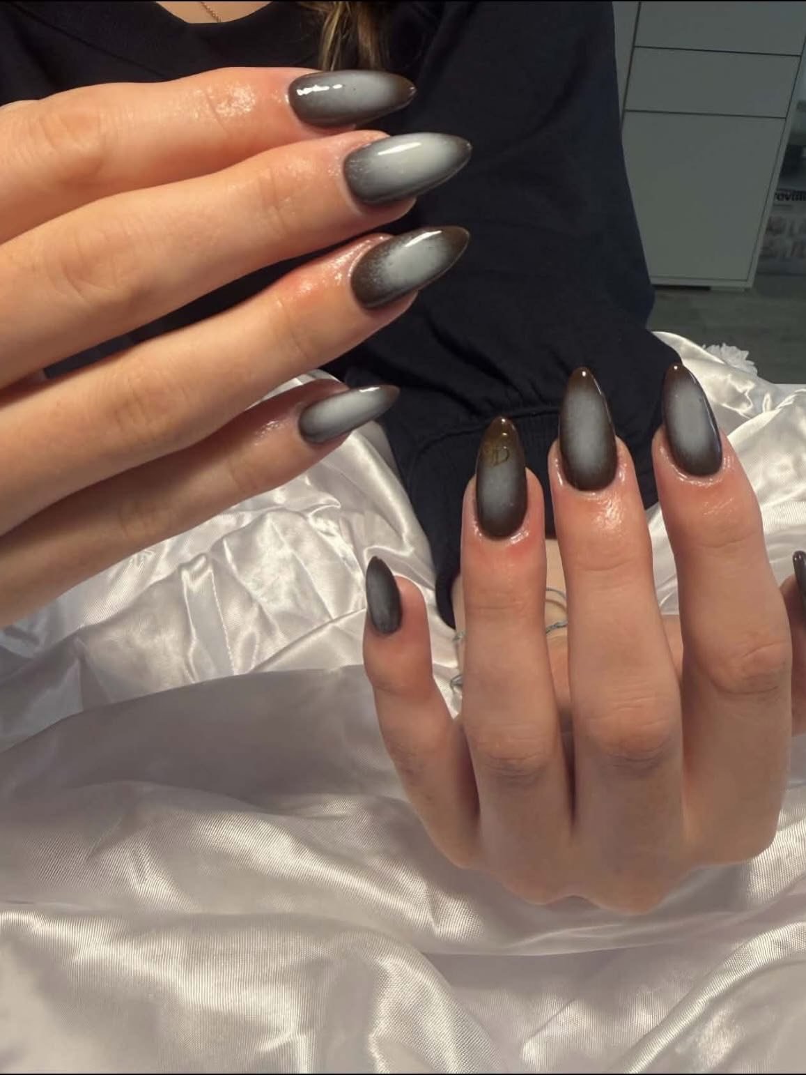 Matte Black and Brown Almond Nails with Minimal Accents