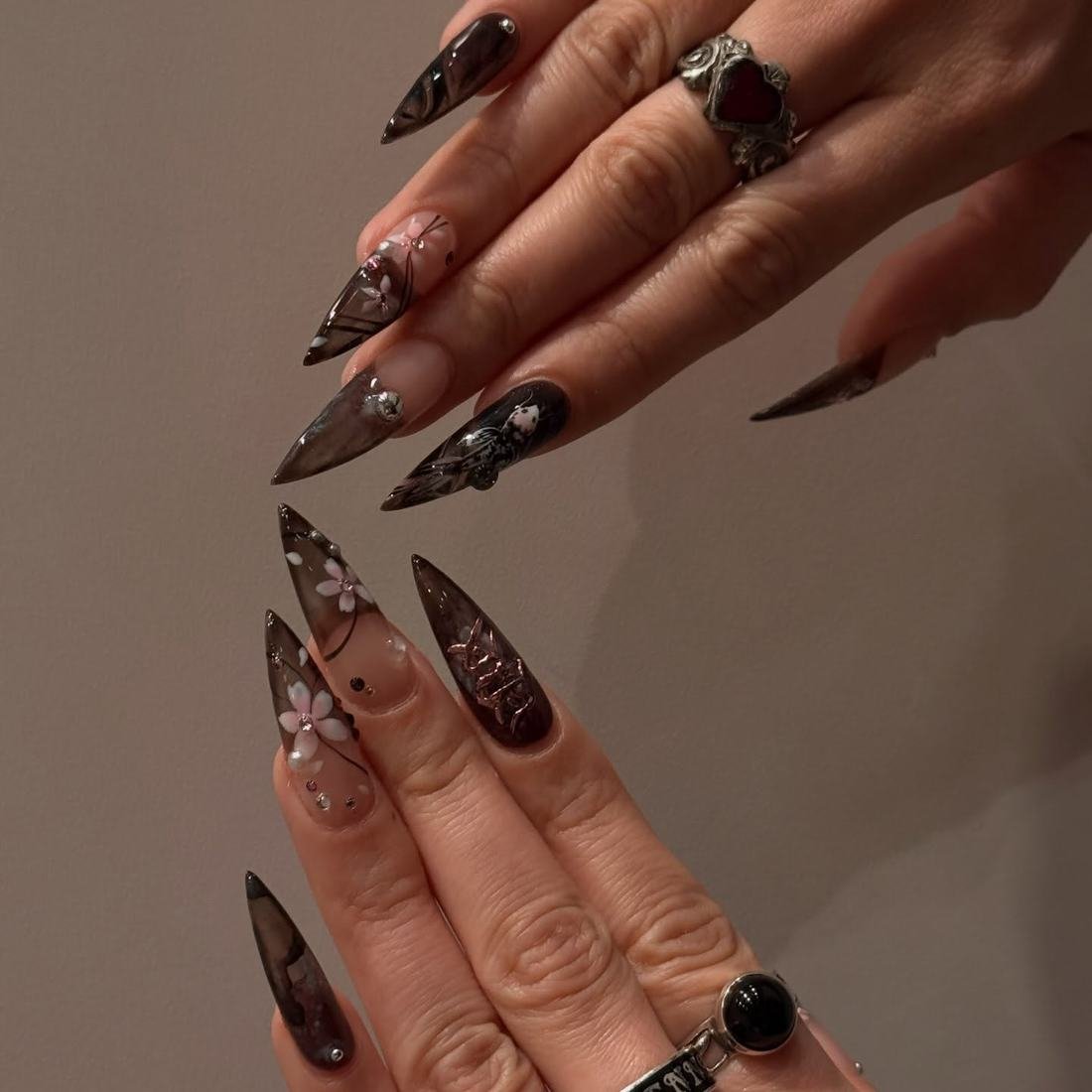 Long Brown and Black Stiletto Nails with Layered Details