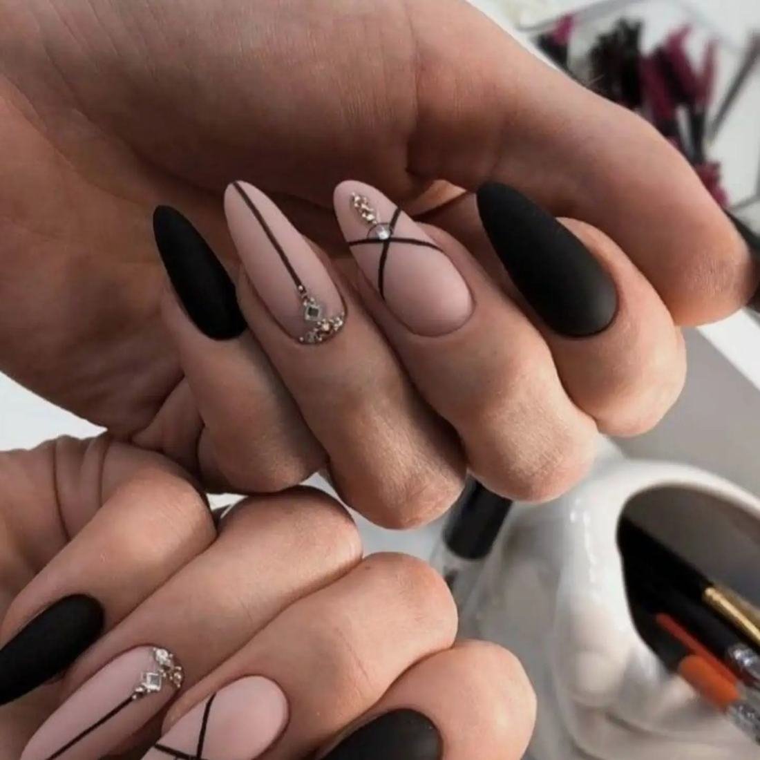 Black and Nude Almond Nails with Fine Line Details