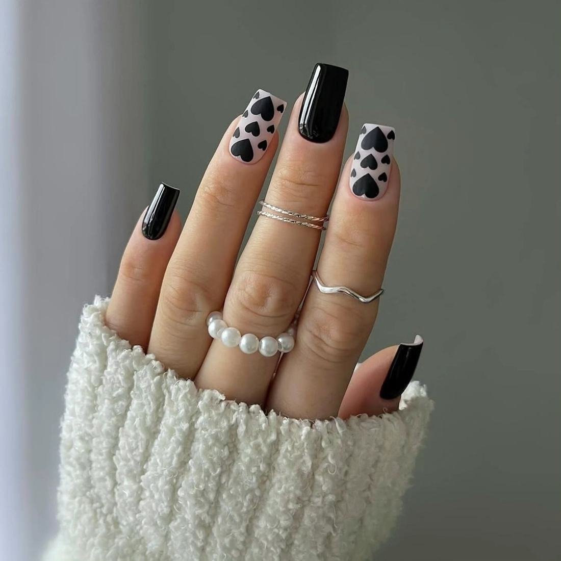 Black and Nude Nails with Dotted Floral Accents