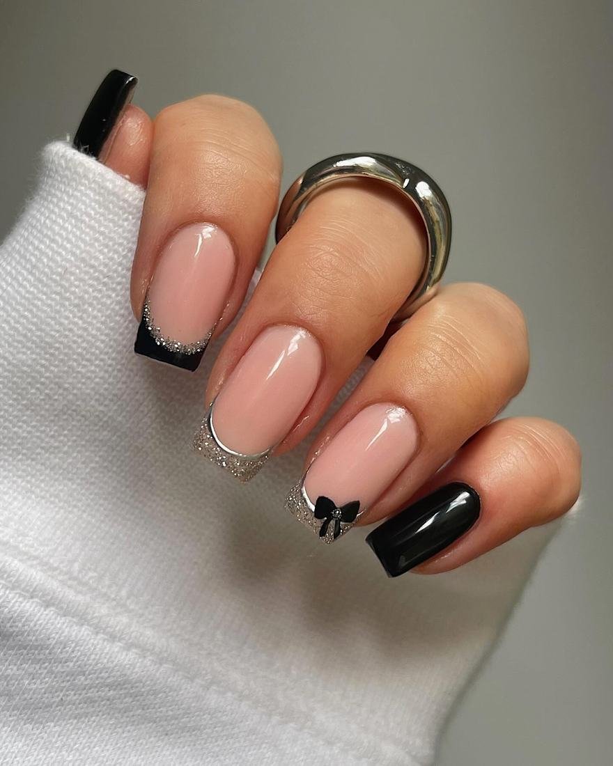 Short Nude Nails with Black French Tips and Glitter Accents