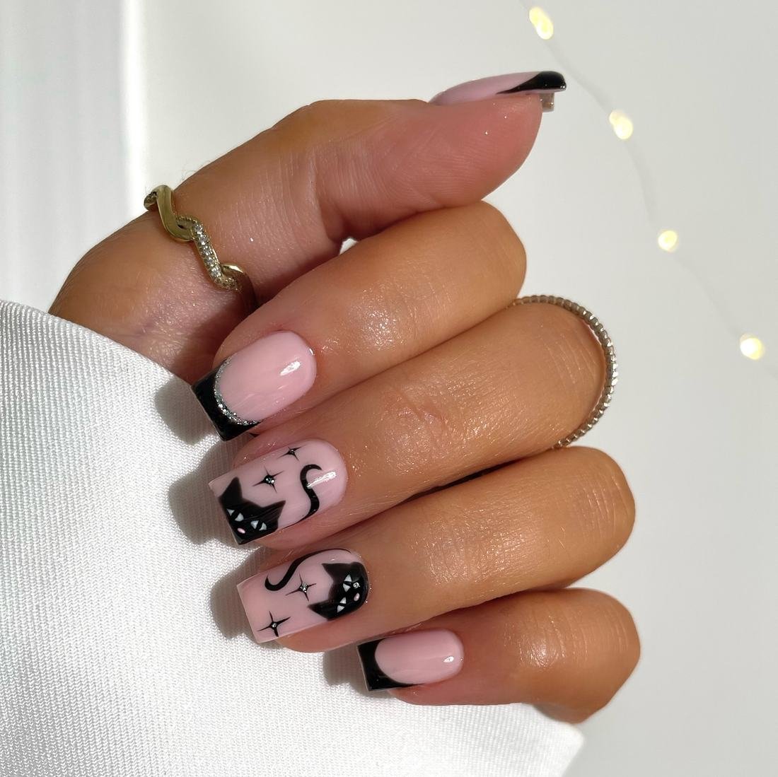 Short Pink Nails with Black French Tips and Tiny Details