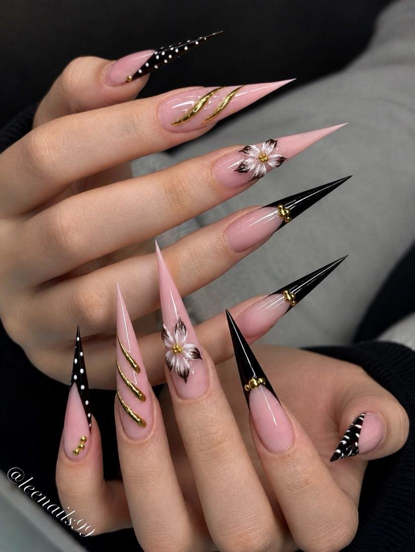 Long Pink Stiletto Nails with Black and Floral Accents
