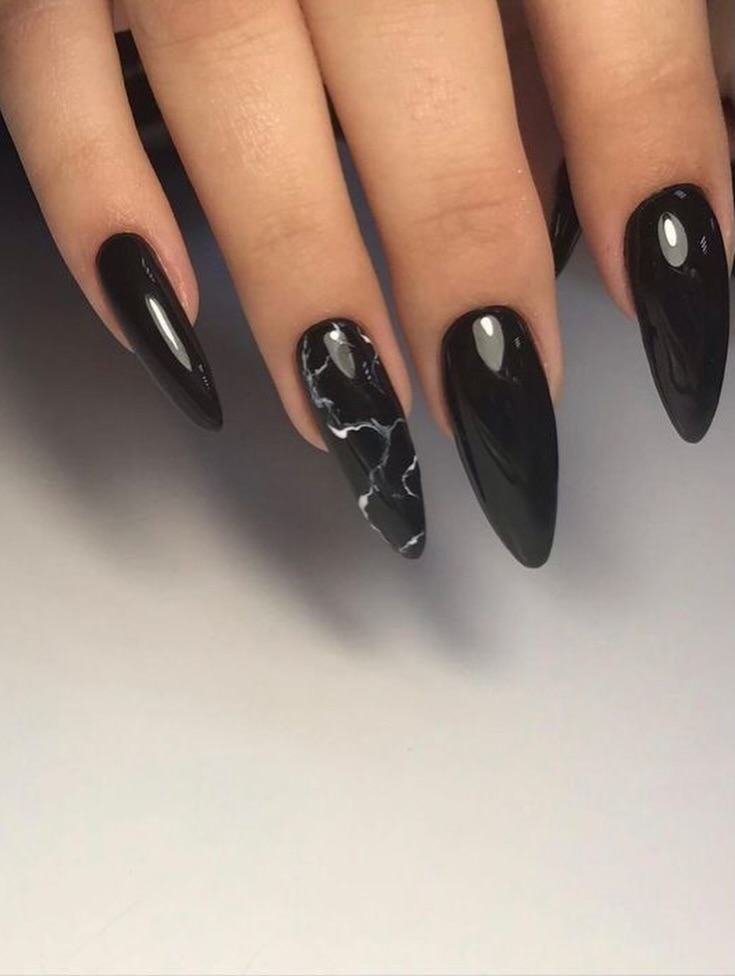 Long Black Almond Nails with a Marbled Accent