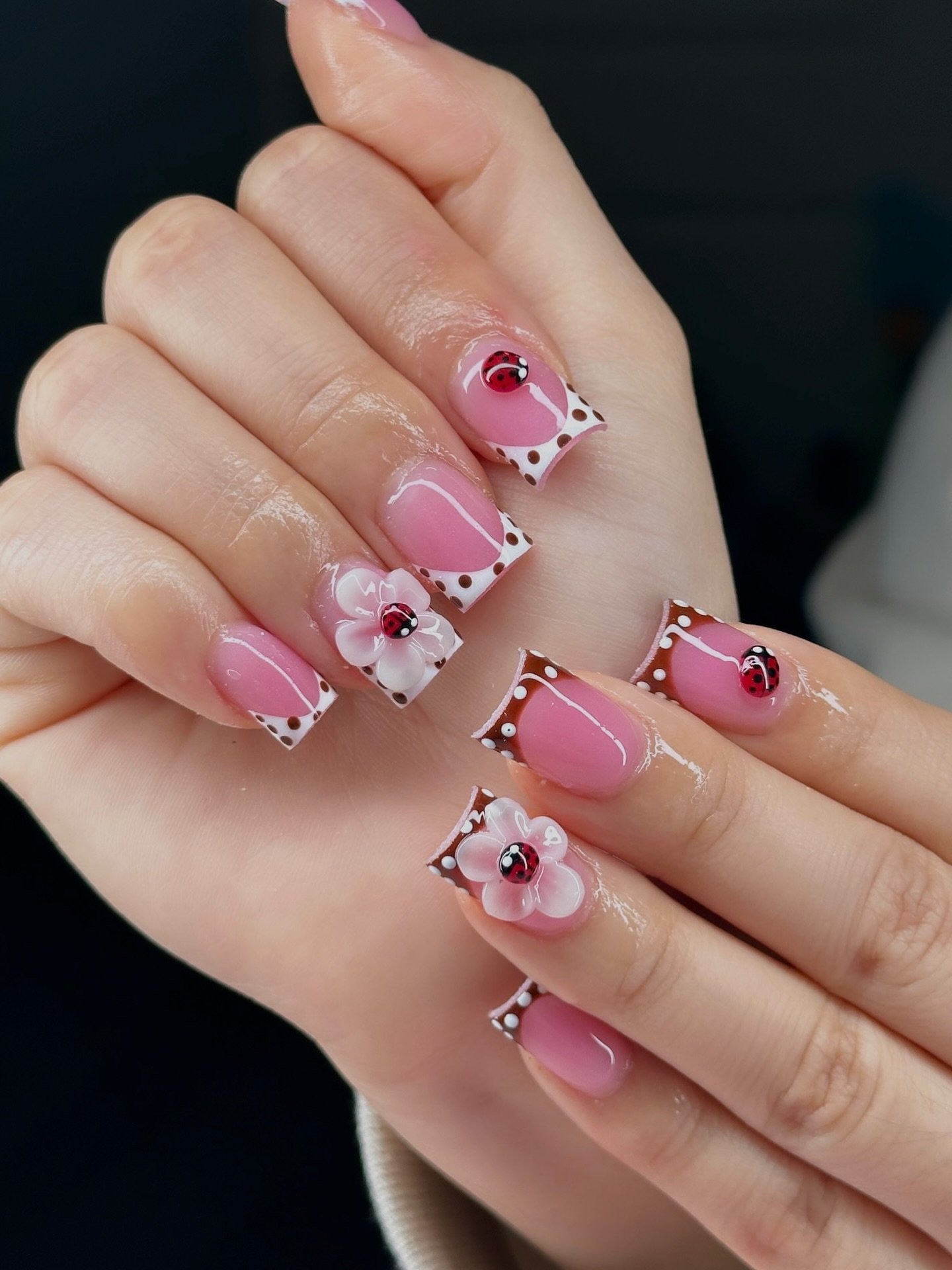 Short Pink Nails with White Floral and Gem Accents