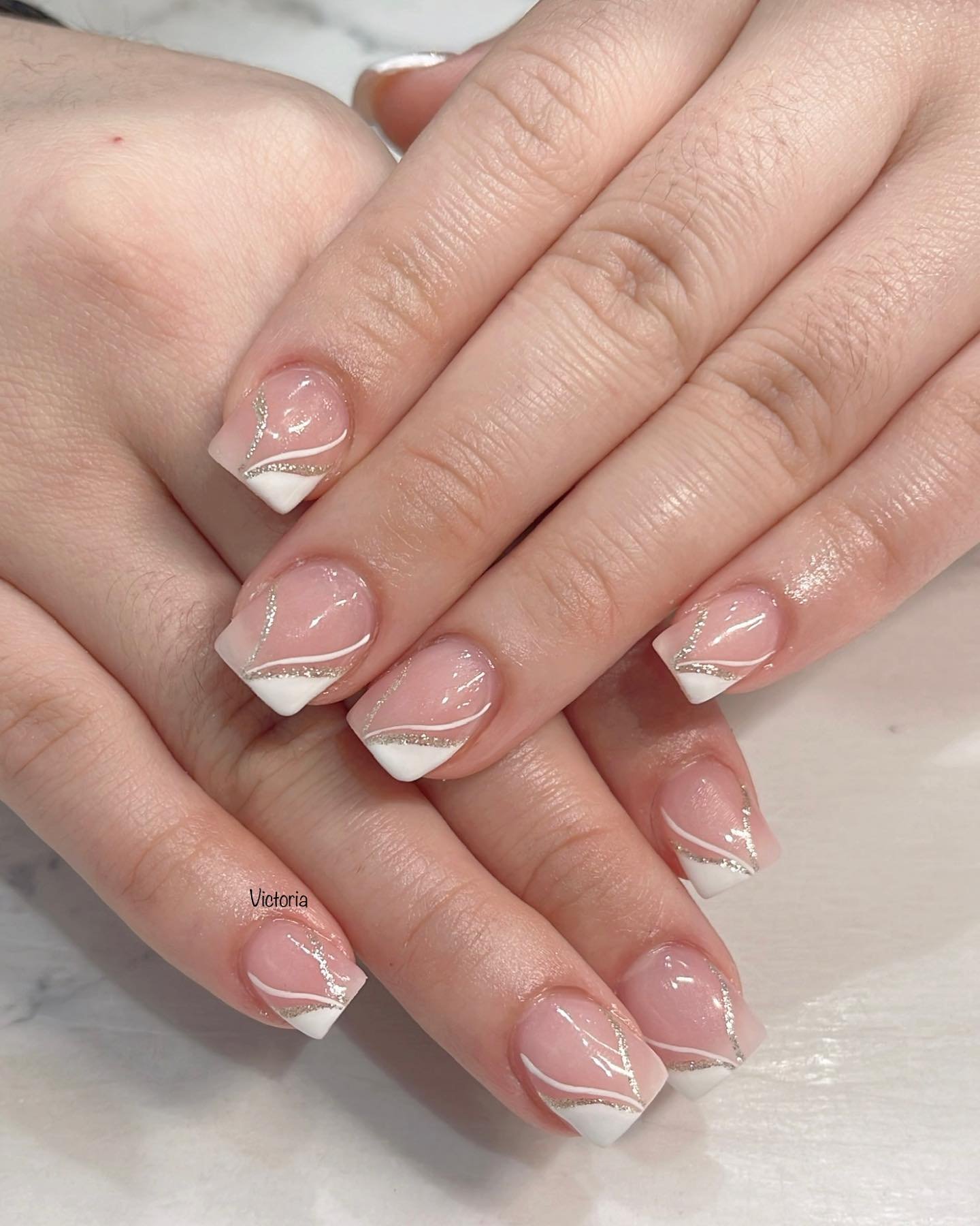 Short Nude-Pink Nails with White French Tips and Fine Lines