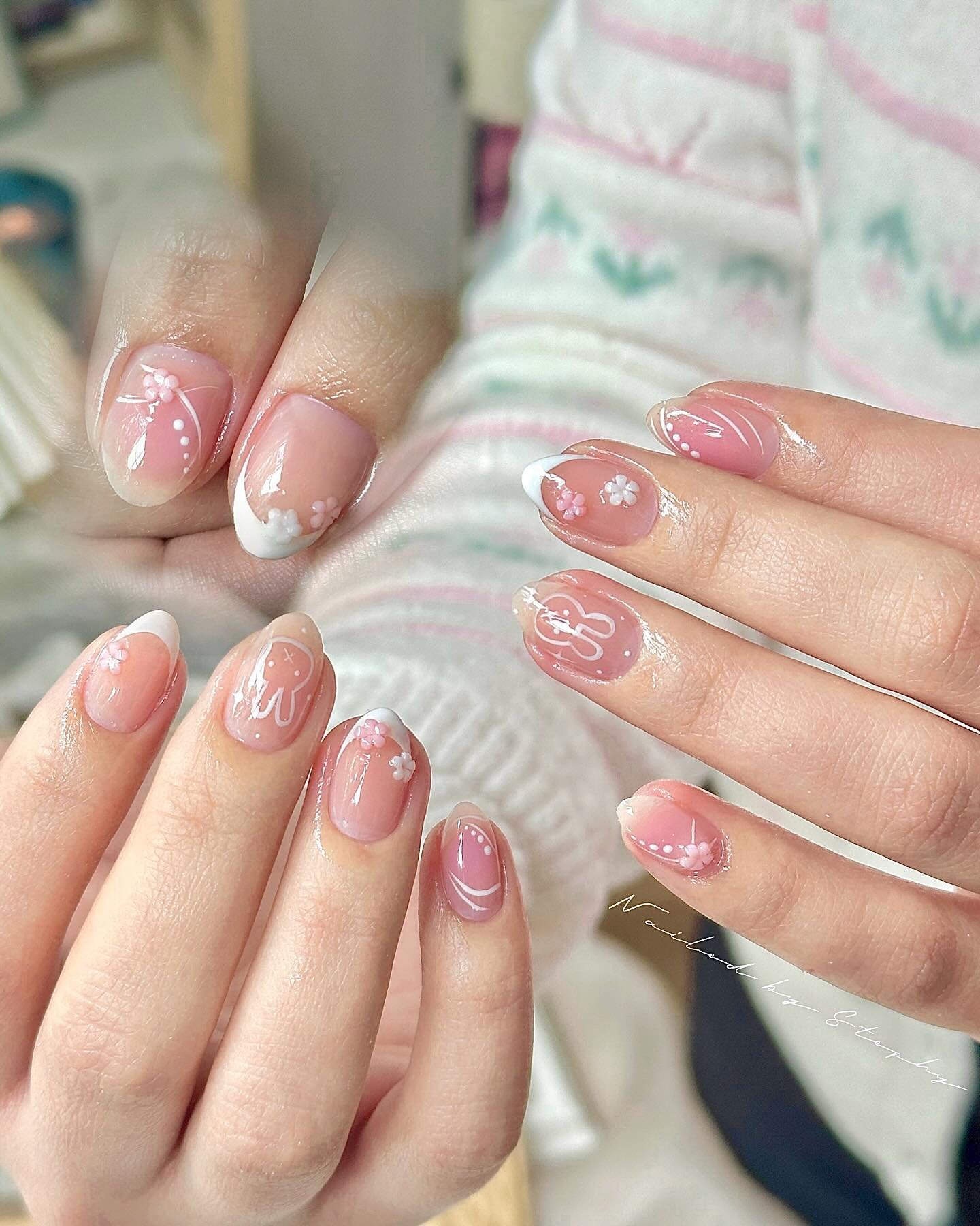 Short Pink Nails with Small White Floral Details