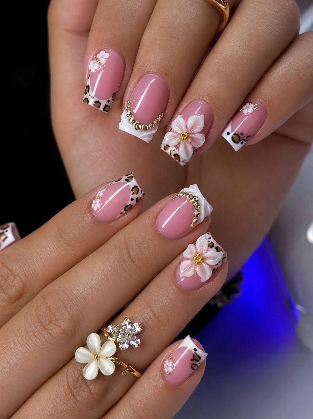 Short Pink Nails with White Flowers and Sparkling Accents