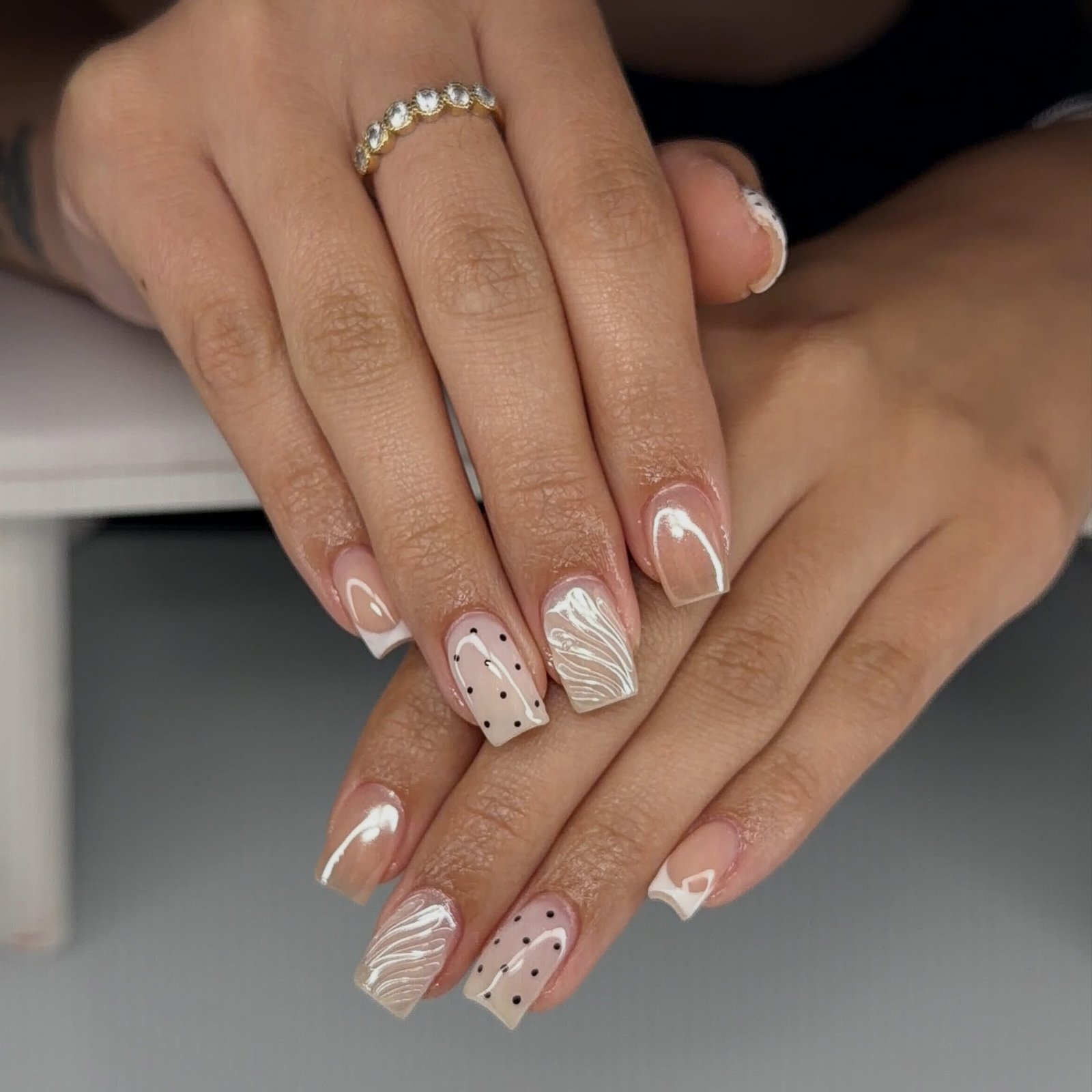 Short Nude Nails with White French Tips, Dots, and Textured Details