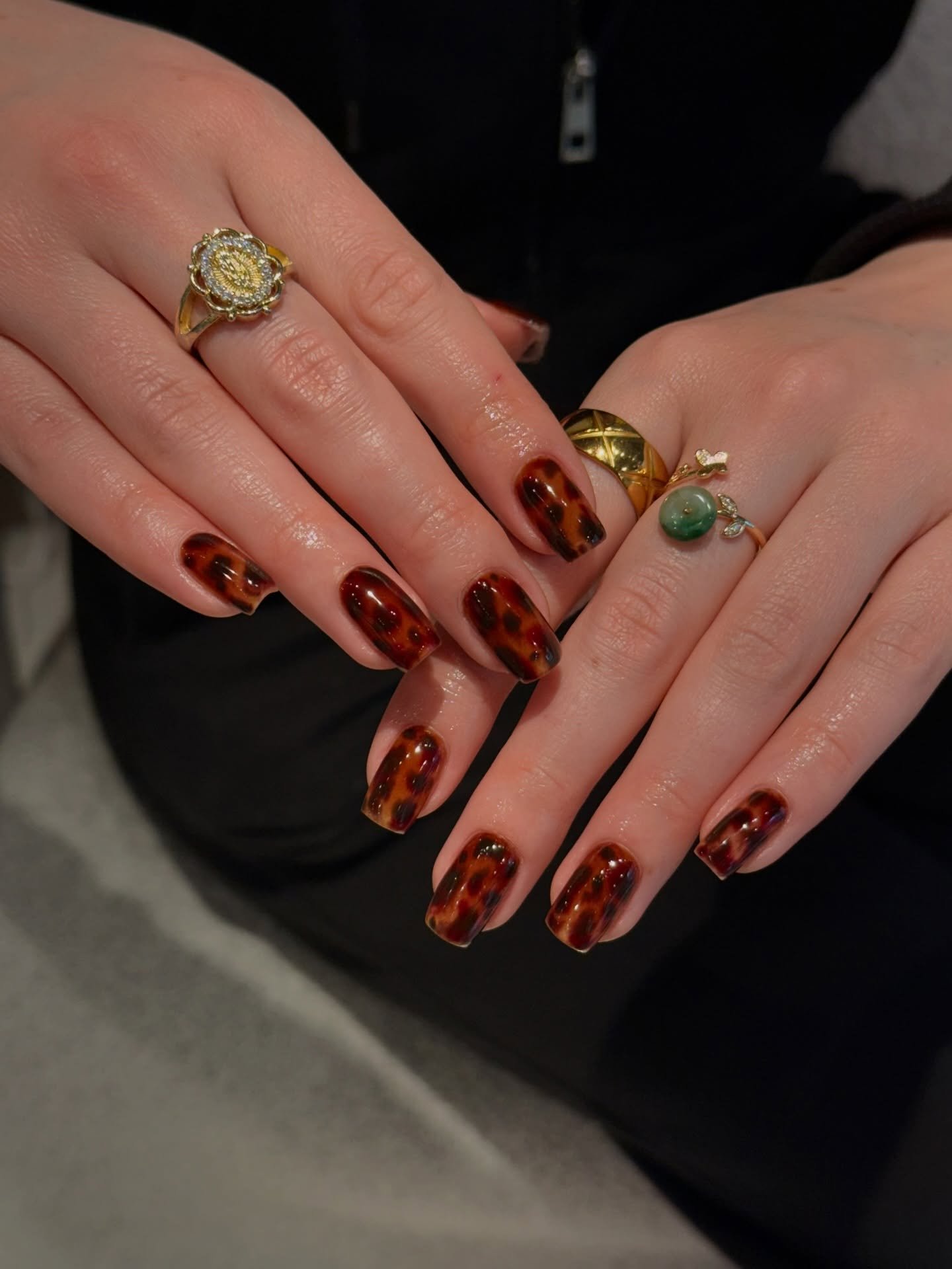 Short Deep Brown Nails with Warm Gold and Green Accents
