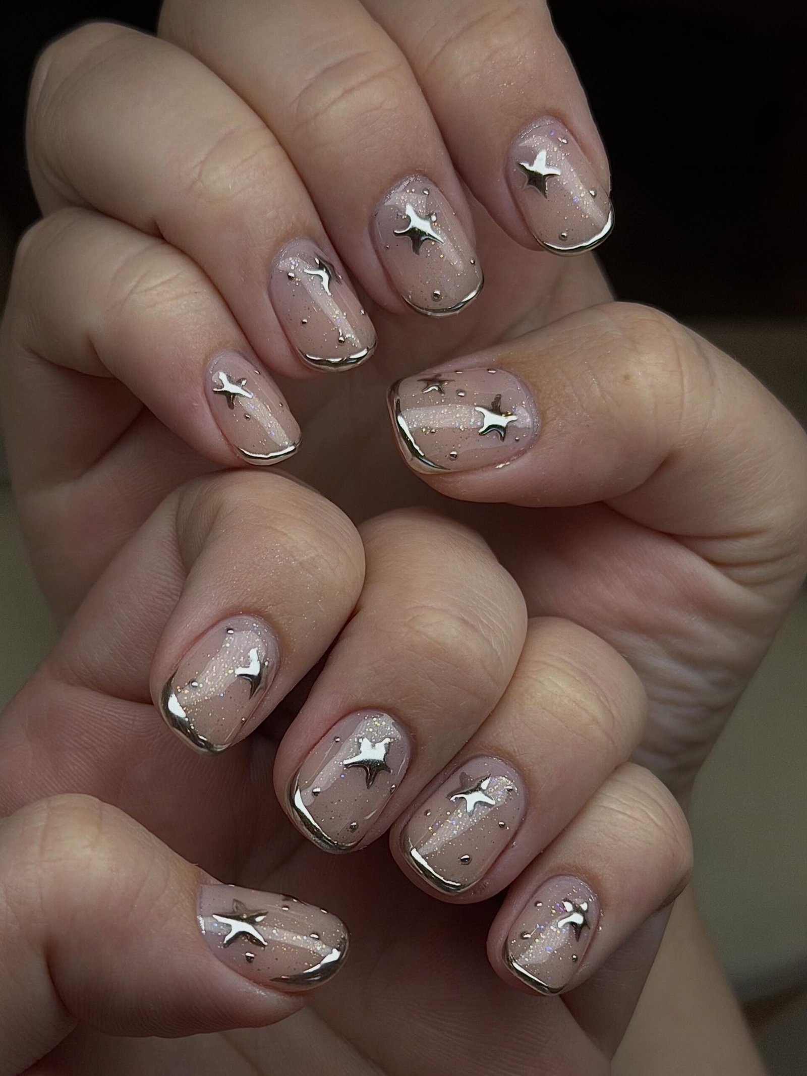 Short Taupe Nails with Tiny White Star Accents