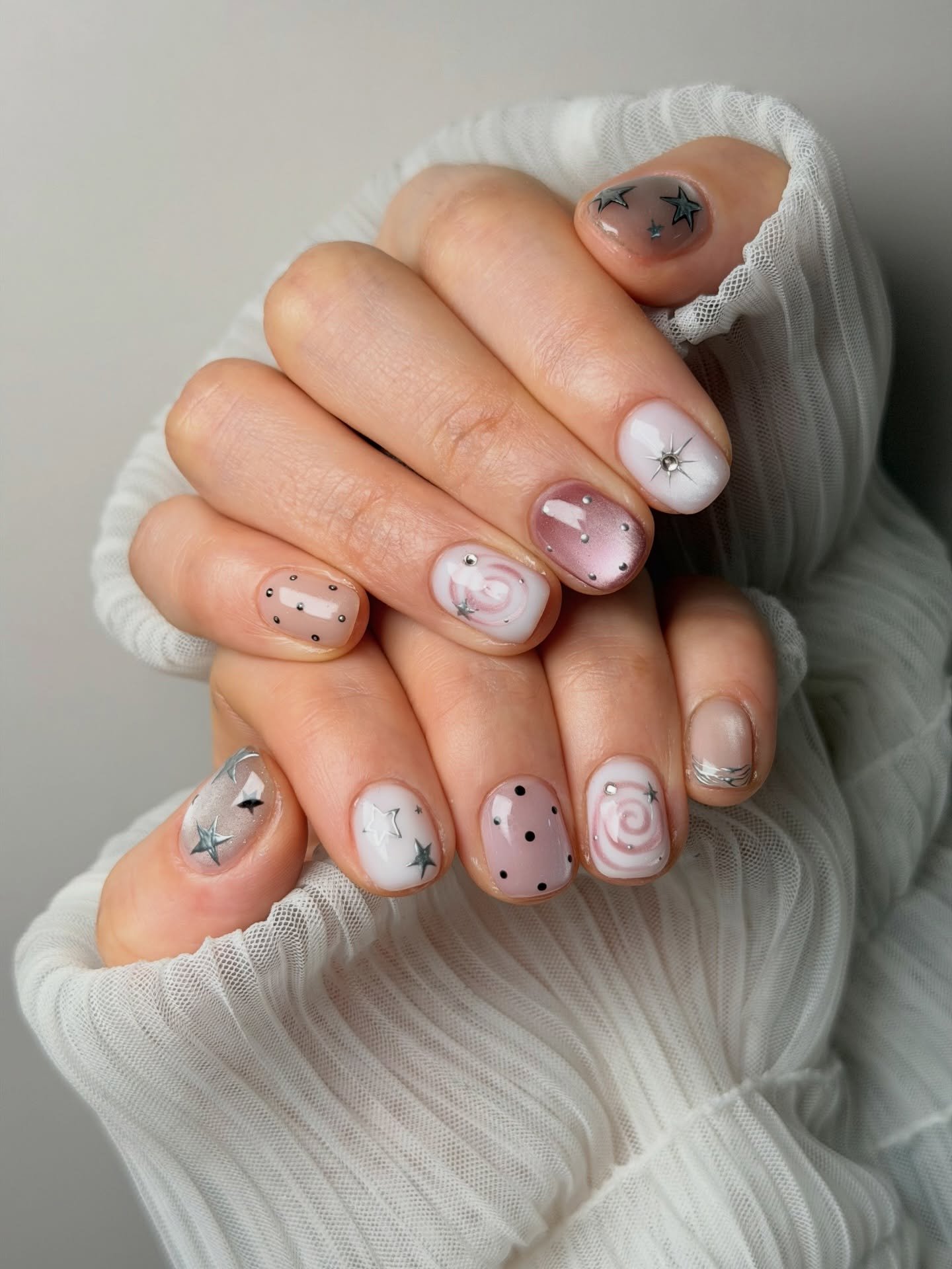 Short Nude-Pink Nails with Tiny Line and Swirl Details