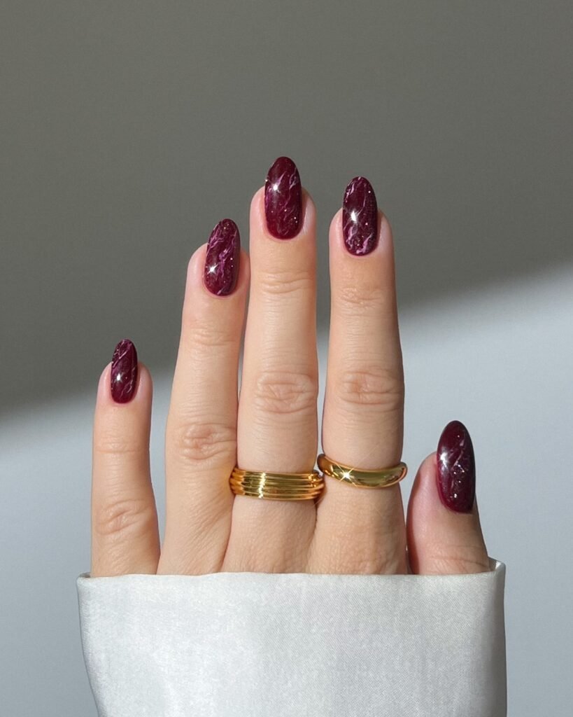 Deep Burgundy Almond Nails with Subtle Shimmer
