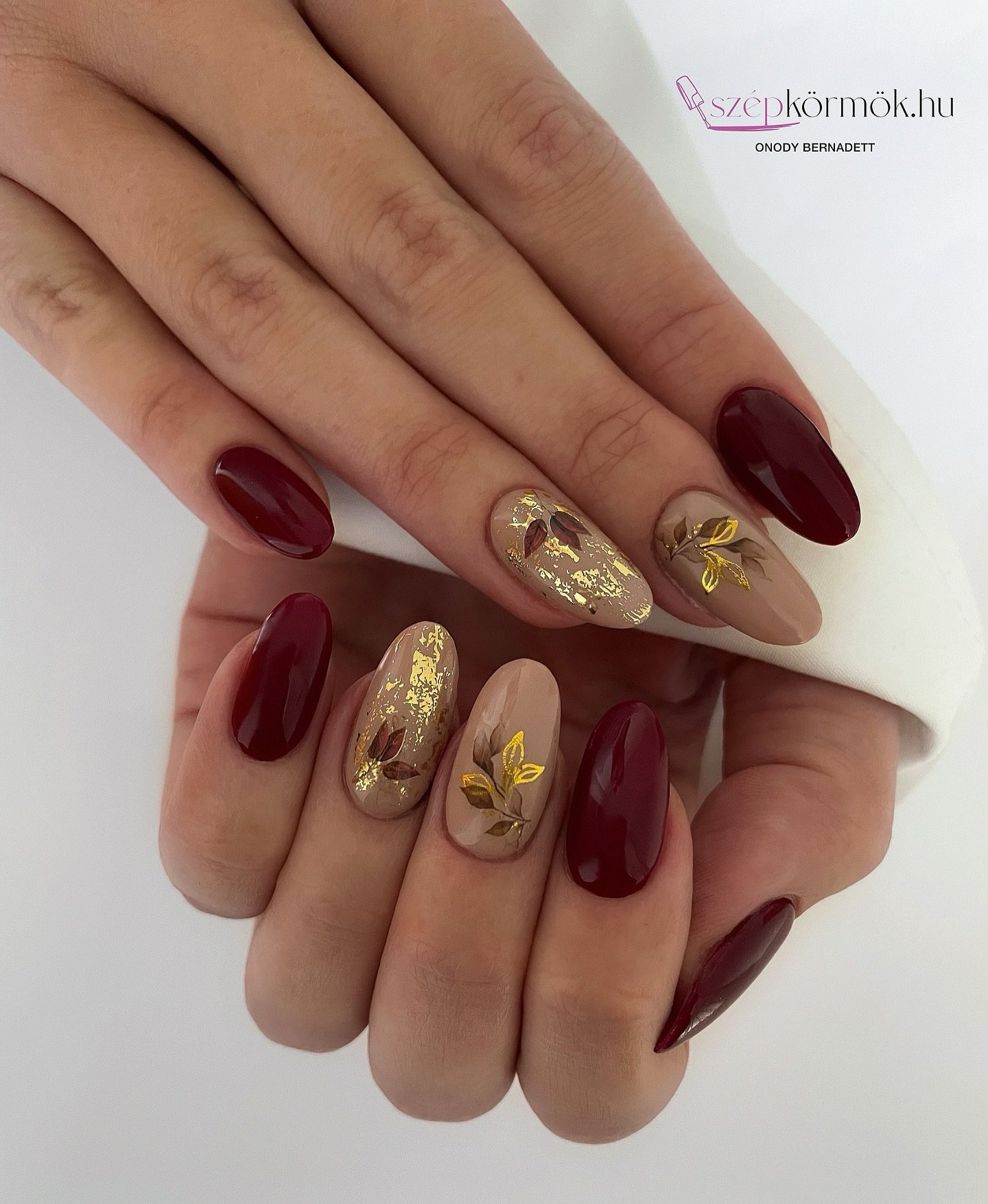 Burgundy Nails with Gold Botanical Accents
