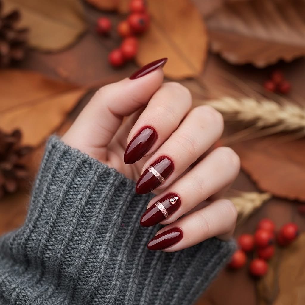 Burgundy Almond Nails with Fine Nude Stripes