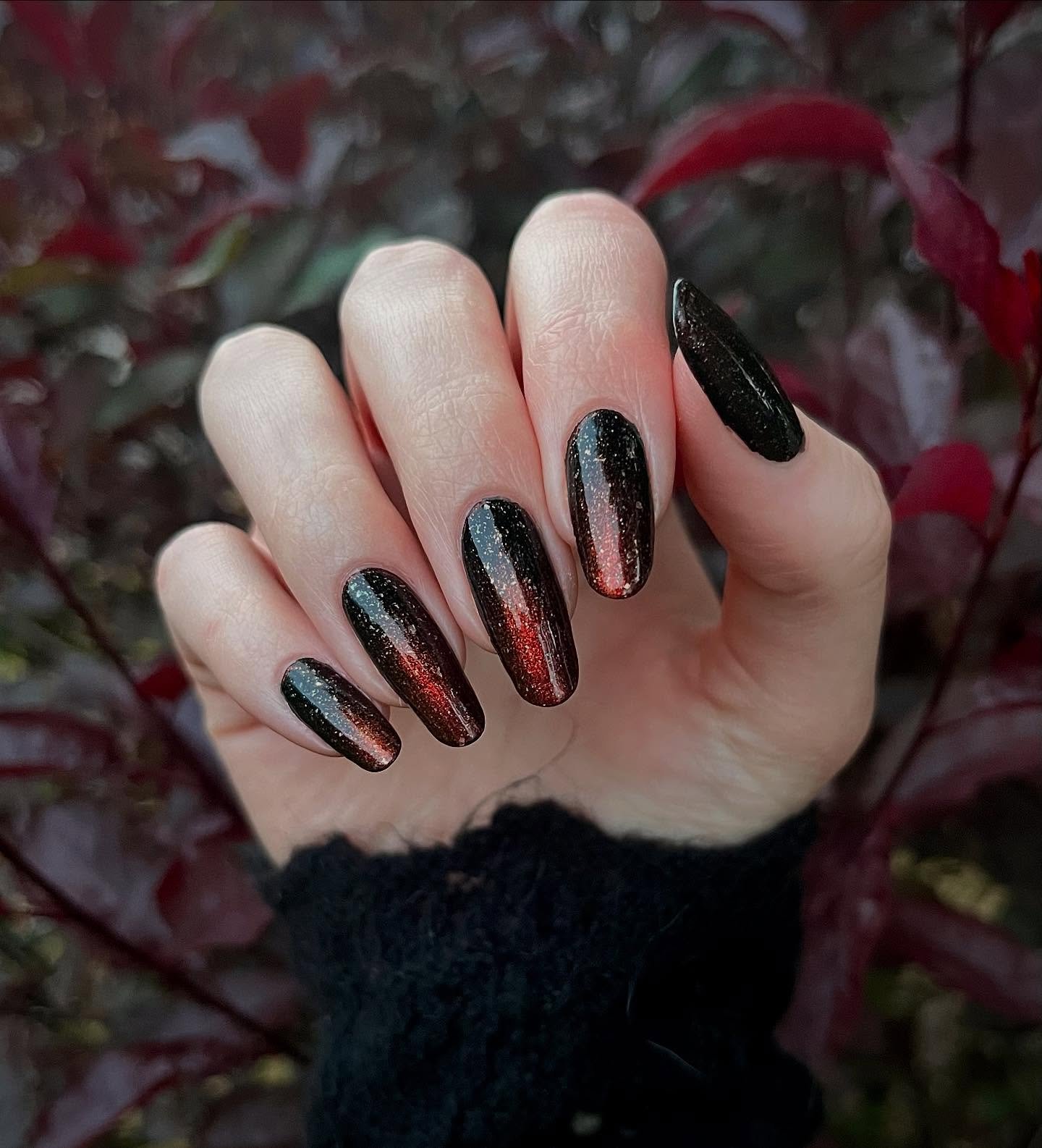 Dark Glitter Almond Nails with Iridescent Sparkle
