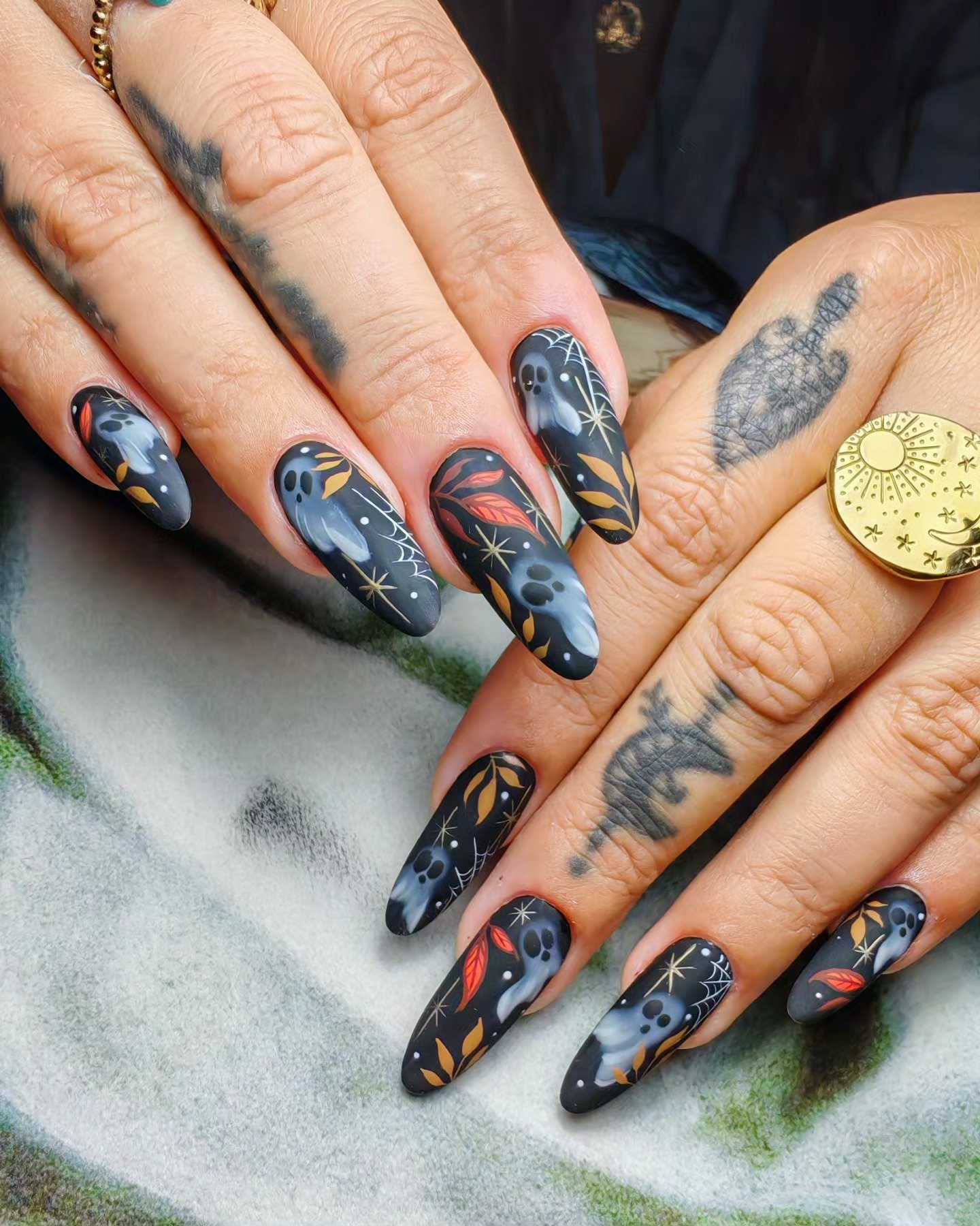 Dark Blue Halloween Nails with Celestial and Spooky Motifs