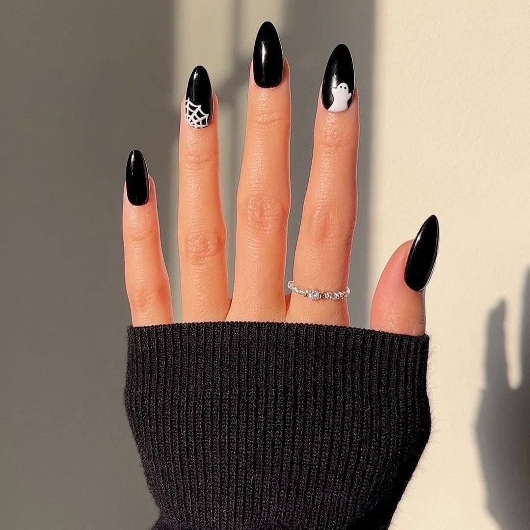 Black Almond Nails with Small White Halloween Accents