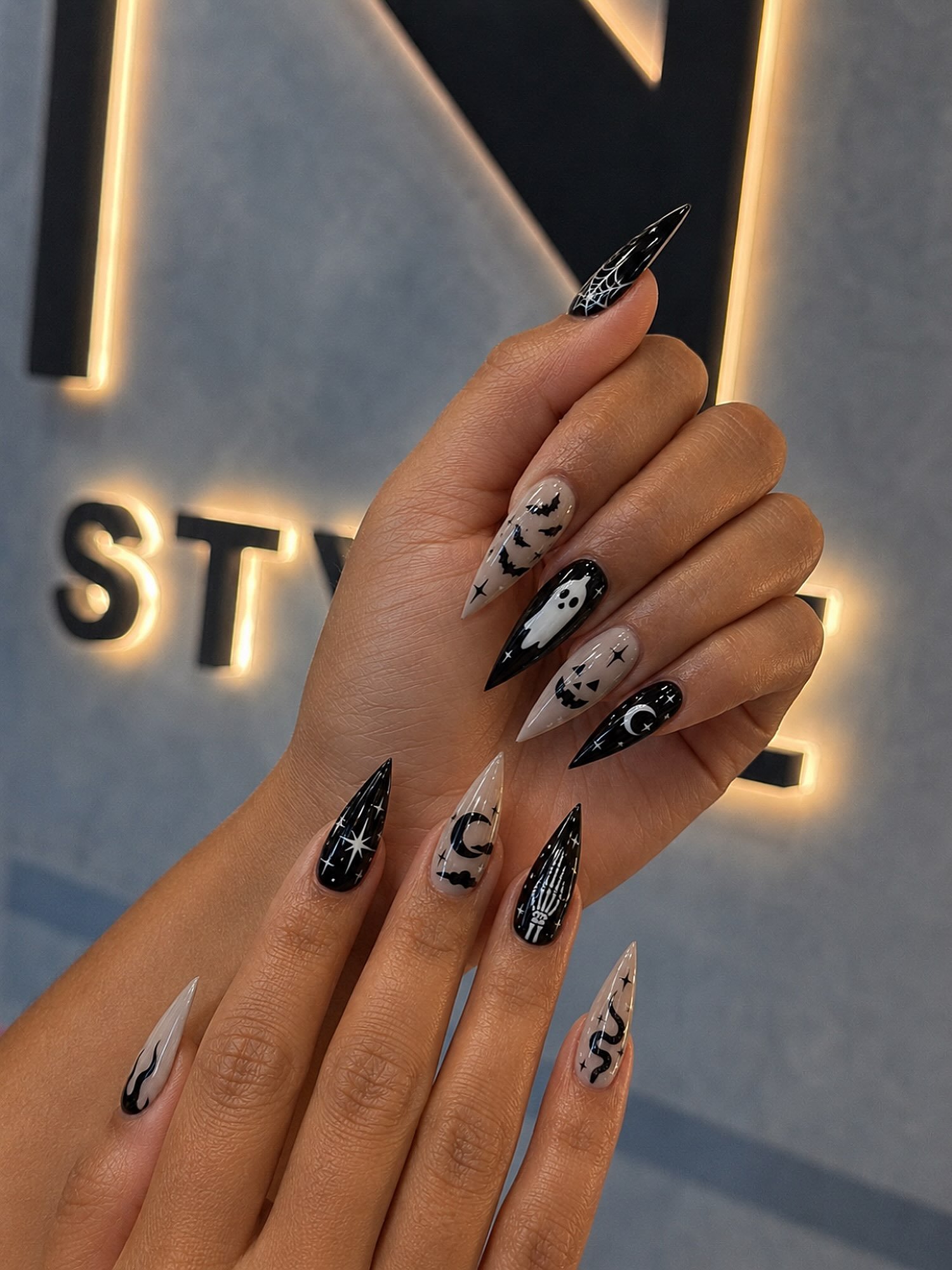 Black, White, and Nude Halloween Nails with Spiders and Curves