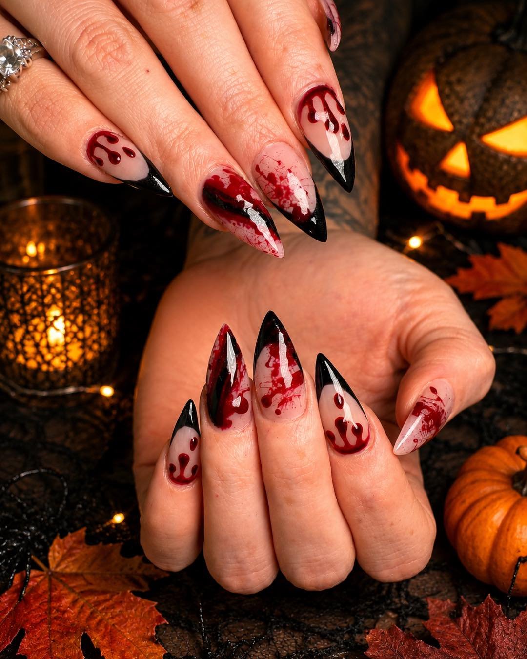 White and Black Stiletto Nails with Deep Red Halloween Drips